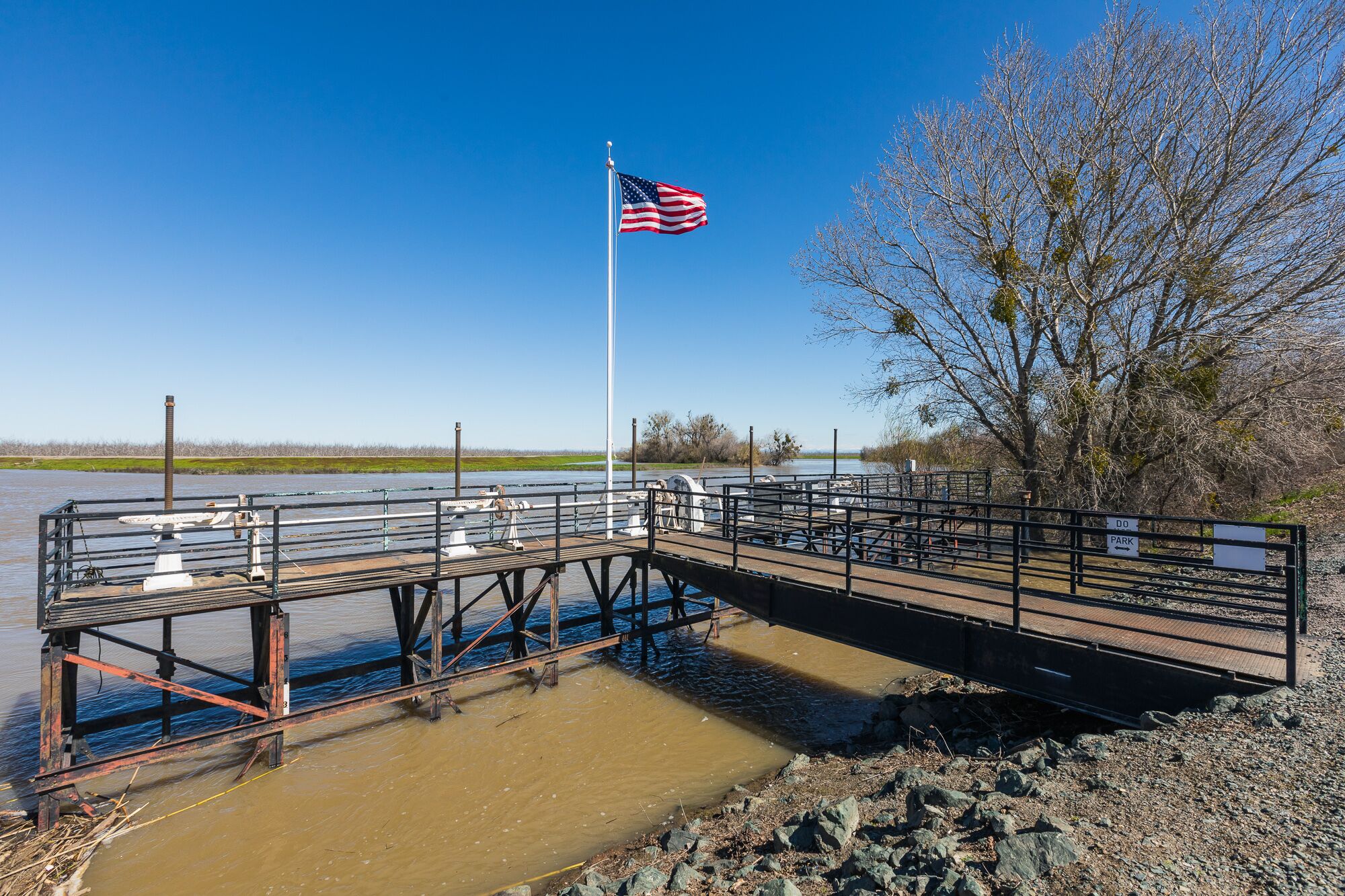 Across from the Rough and Ready Pumping Plant, which diverts water from the Sacramento River to nearby agricultural fields, the old manual gates for controlling water levels are still present.