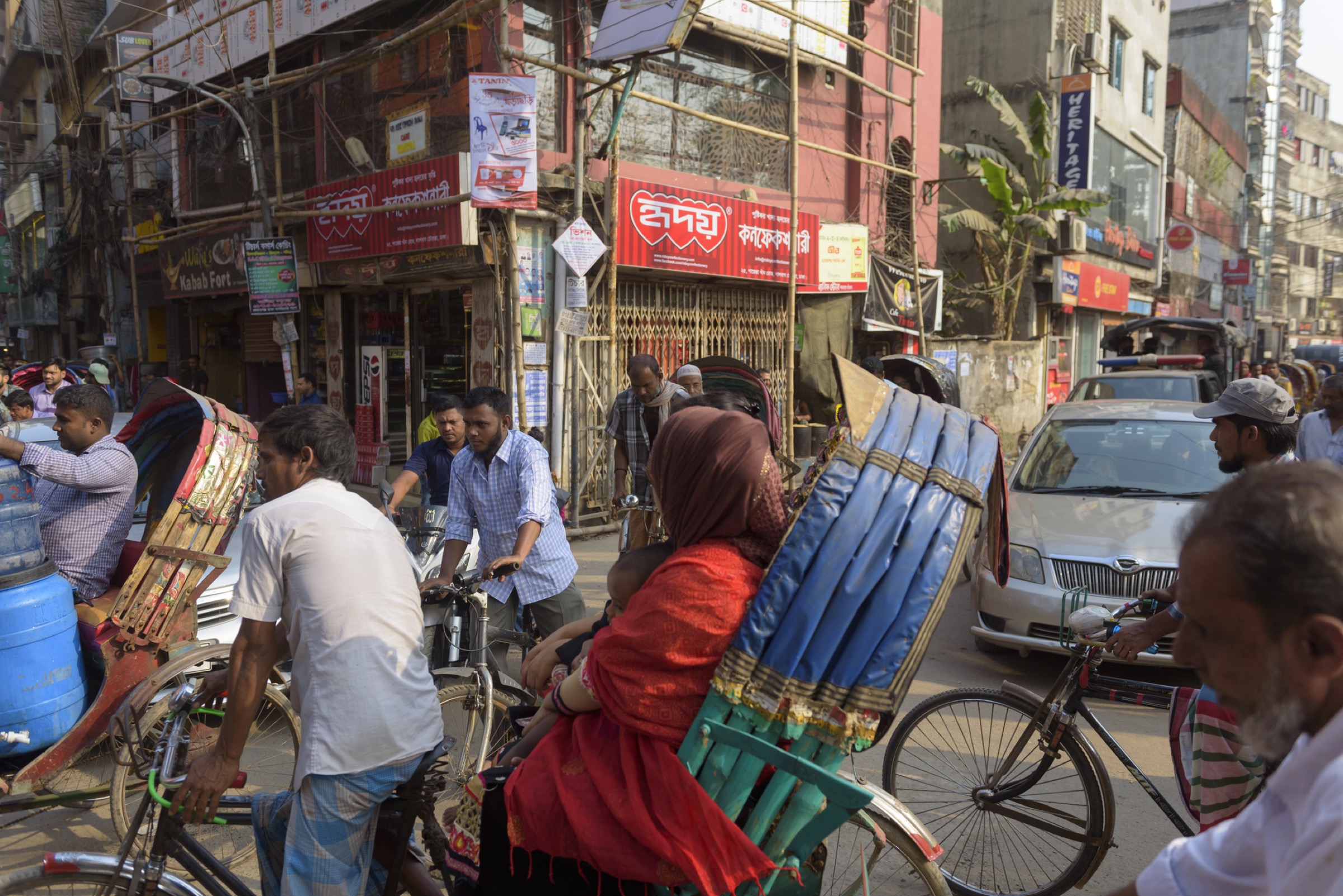 The crush of humanity is almost impossible to avoid in Bangladesh, a country roughly the size of the state of Illinois and packed with 165 million people. Photograph by Joel Carillet