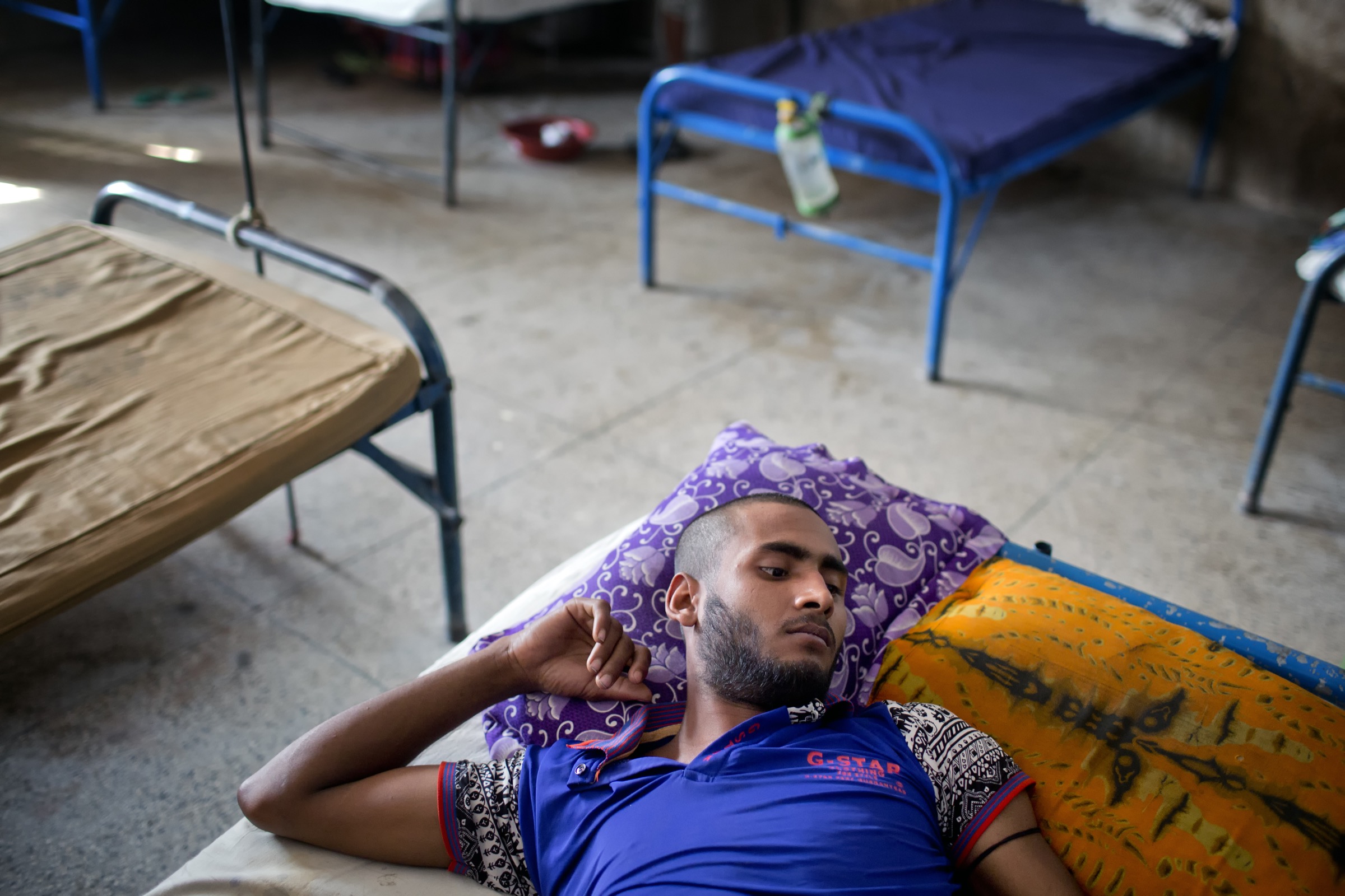 According to Johns Hopkins University epidemiologist Emily Gurley, Bangladesh medical facilities have very little to offer patients like this young man in the Faridpur Medical College Hospital, so often people who fall ill don’t bother to seek treatment. That can make tracking diseases like Nipah a huge challenge. Photograph by A.M. Ahad