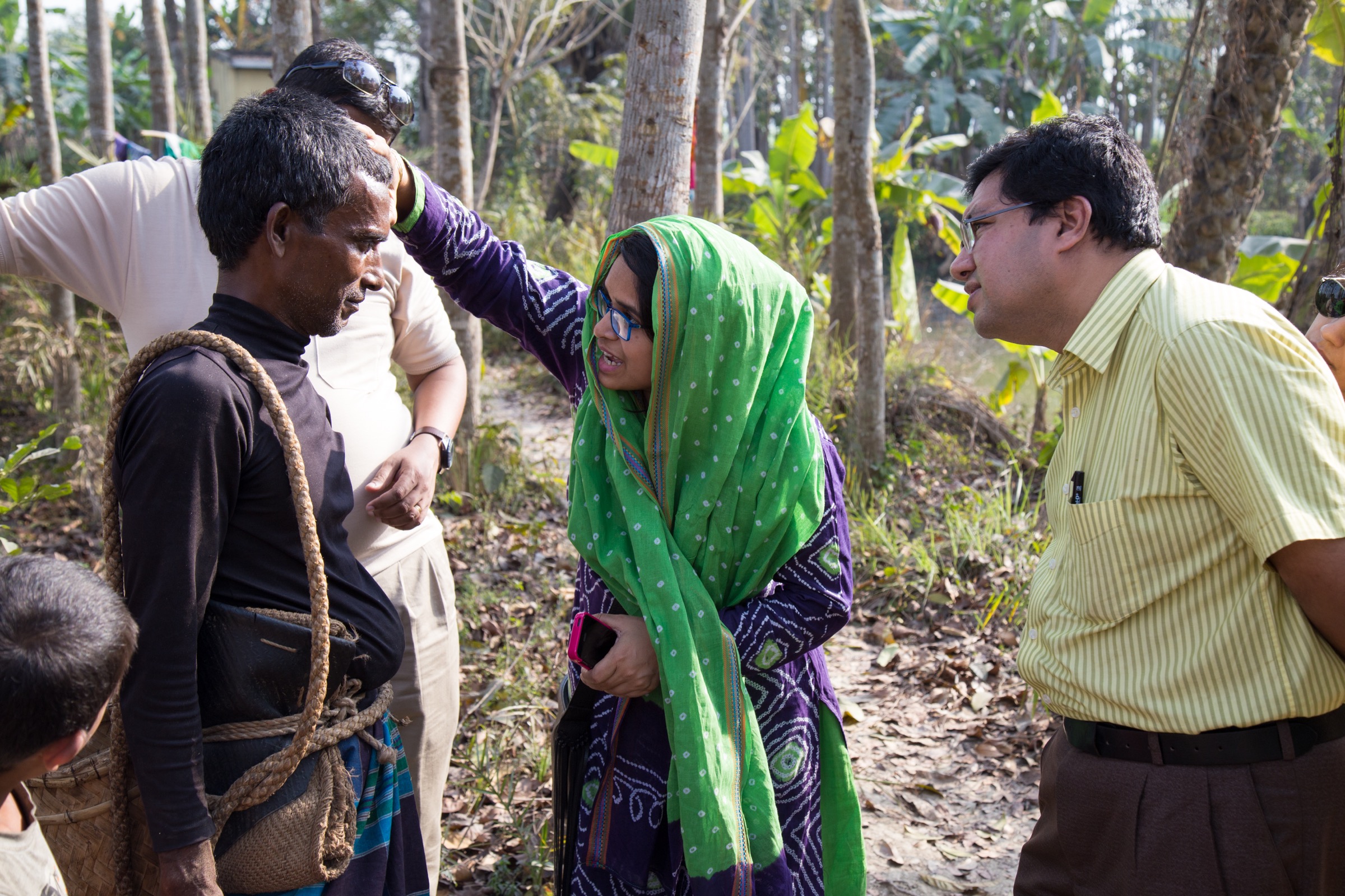Arifa Nazneen and Hossain M. S. Sazzad, members of ICDDR,B Nipah surveillance team, conduct a physical examination of a gachhi in Bangladesh’s Faridpur District. Photograph by Steven Bedard