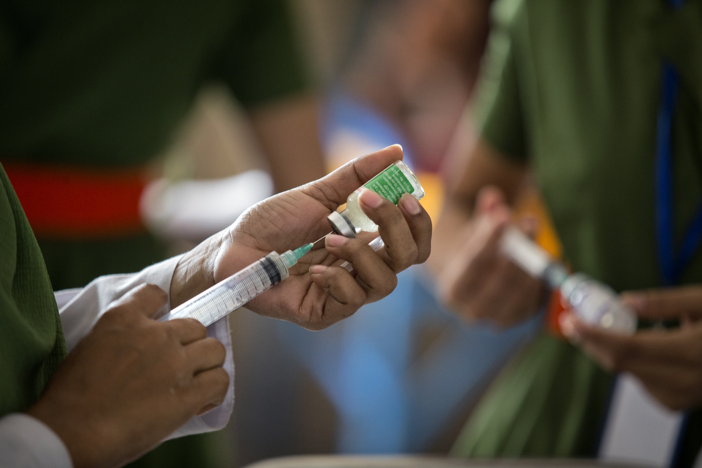 Nurses at Faridpur Medical College Hospital prepare injections that they hope will bolster their patients’ immune systems, but by most accounts hospitals in Bangladesh can do very little for those who come through the doors, except try to keep them comfortable. Photograph by A.M. Ahad