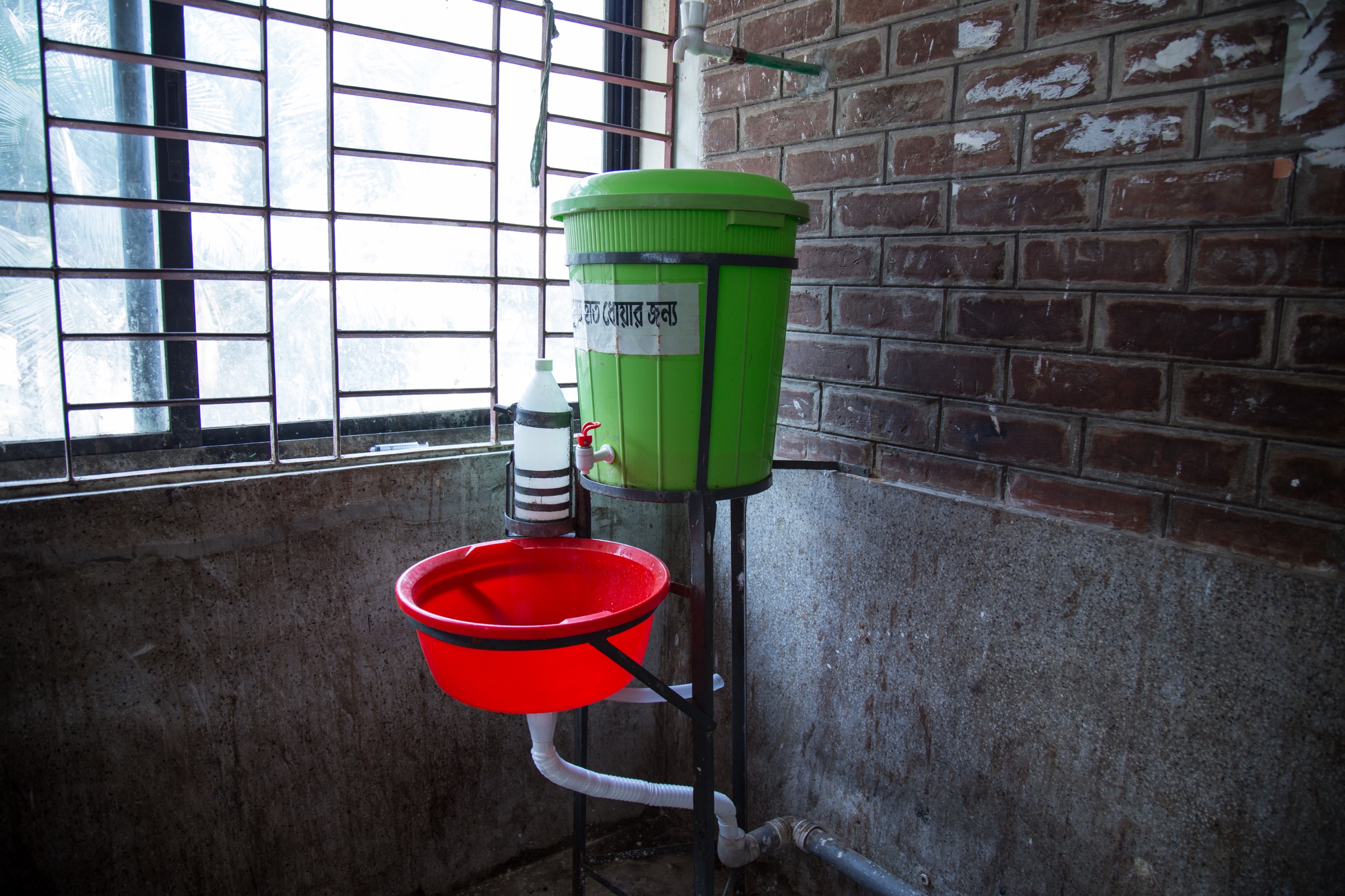 While it’s not the source of hot, running water that one might expect in a hospital, this wash basin in Faridpur Medical College Hospital at least provides some means of sanitation for staff and family caregivers—as long as people use them. Photograph by Steven Bedard