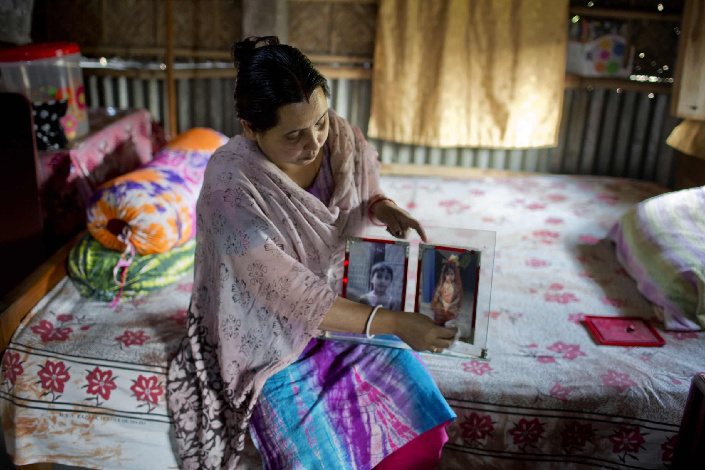 A young mother in northern Bangladesh’s Lalmonirhat District still grieves over the death of her two young children during the 2011 Nipah outbreak there. Photograph by A.M. Ahad