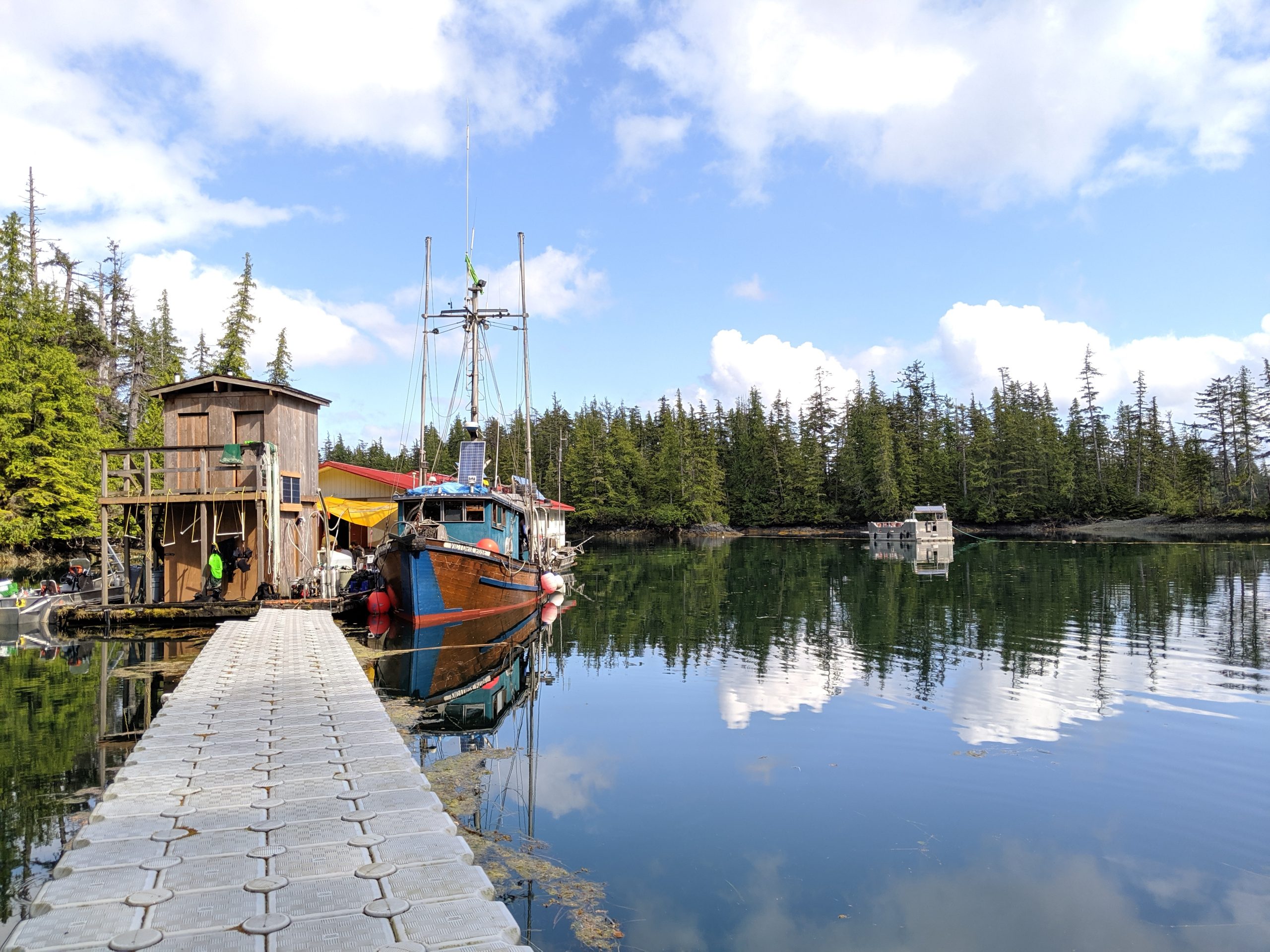 A boat sits at a Parks Canada float camp located in a sheltered bay in the Bischofs, a string of islands about 20 minutes by water from the project site. Photograph by Jason G. Goldman