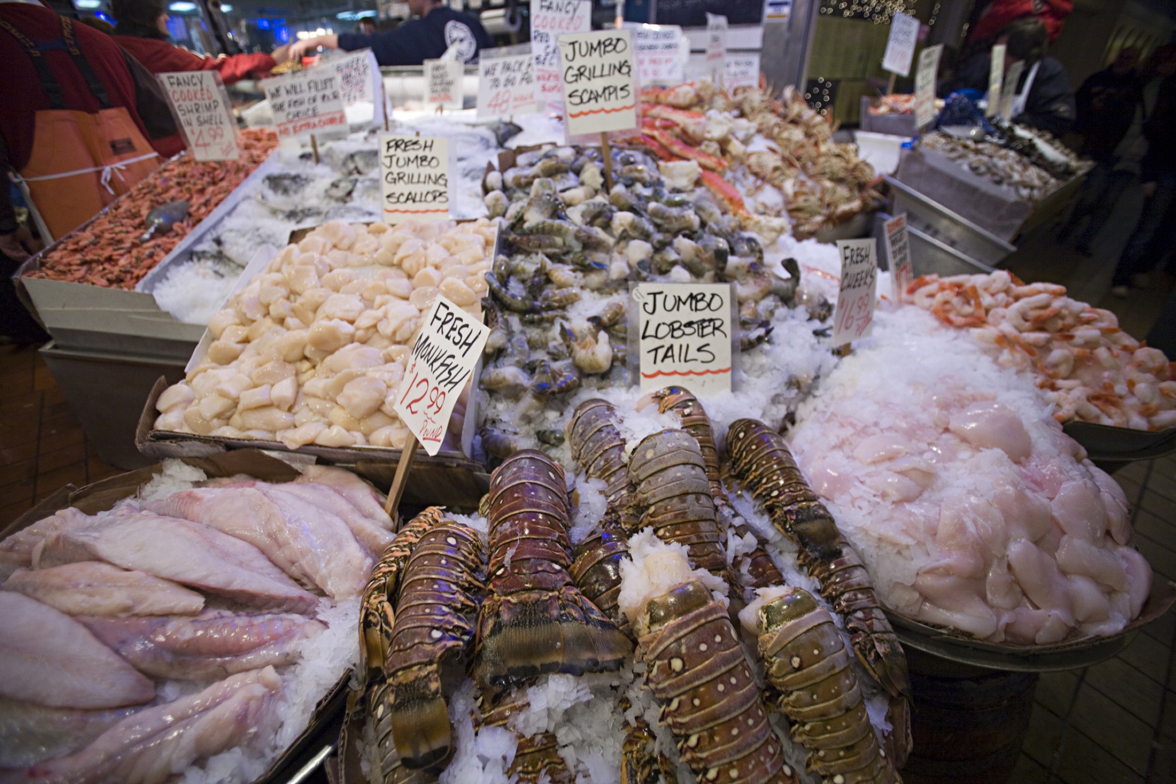 A variety of seafood is displayed on ice at the Pike Street Market in Seattle, Washington. Photograph by Aaron Black