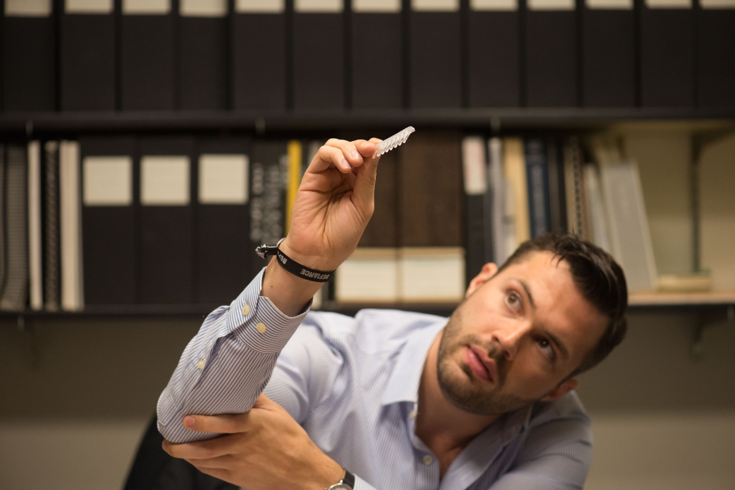 David Baisch, the Molecular Innovations Director at Conservation X Labs, shows how a positive test turns the DNA solution in the test tubes to a turbid, milky consistency. Photograph by Daniel Berman