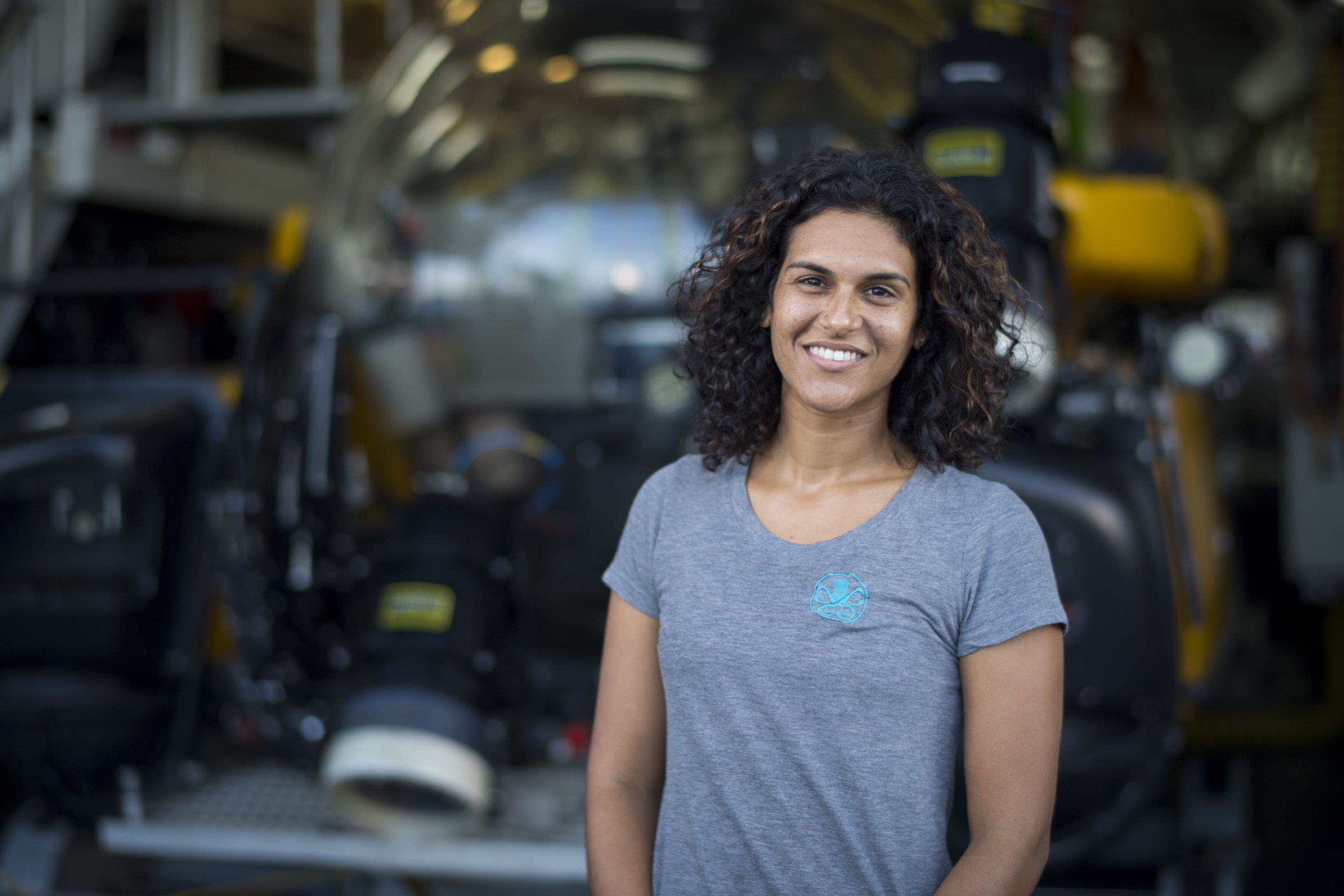 Diva Amon, a marine biologist from the Natural History Museum of London, UK, stands in front of one of the submersibles she has used to study life around deep hydrothermal vents. Photograph by Novus Select