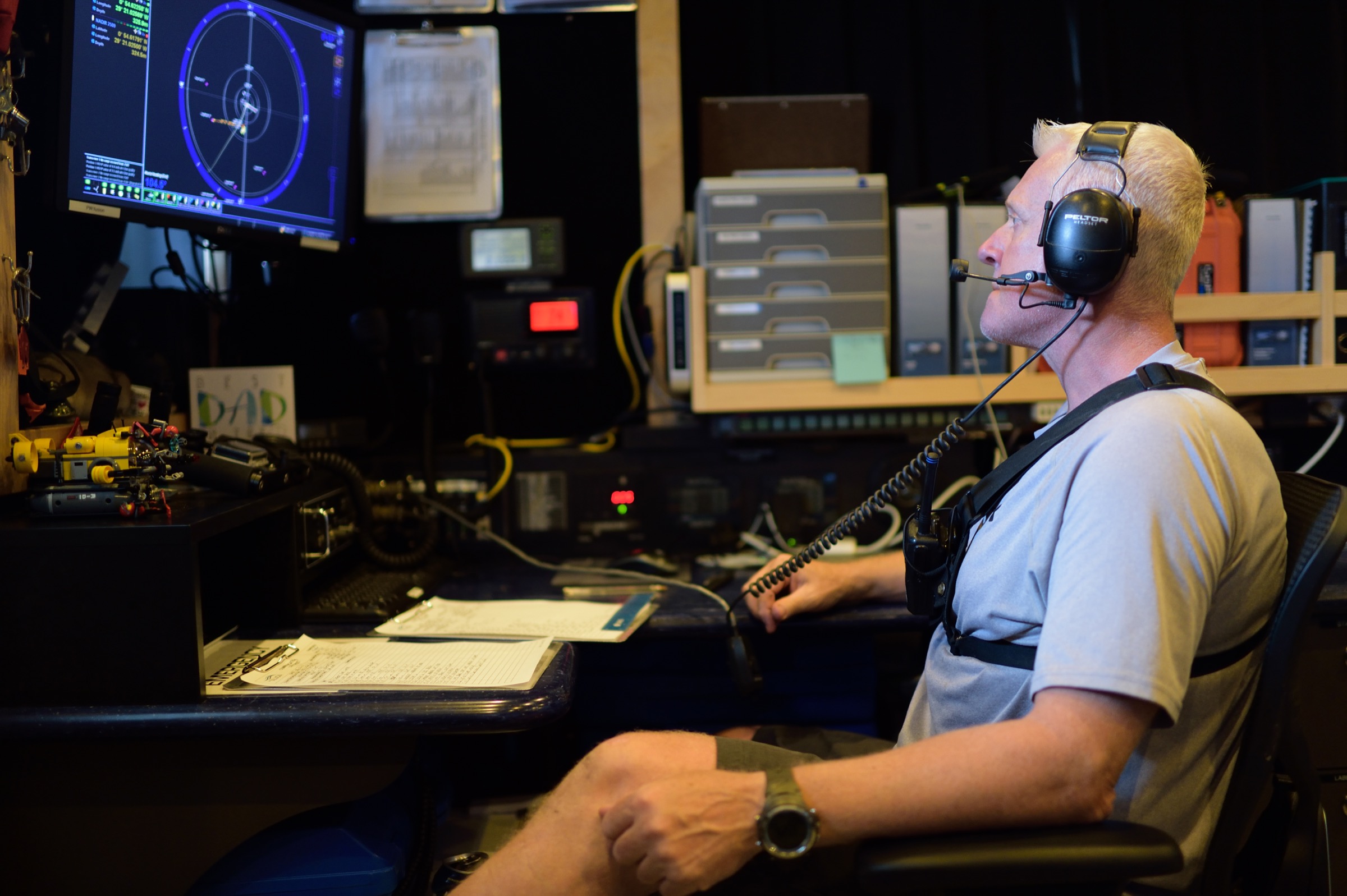 Submarine team leader Alan Scott keeps a close eye on video monitors in the control room onboard the M/V Alucia. Photograph by Solvin Zankl