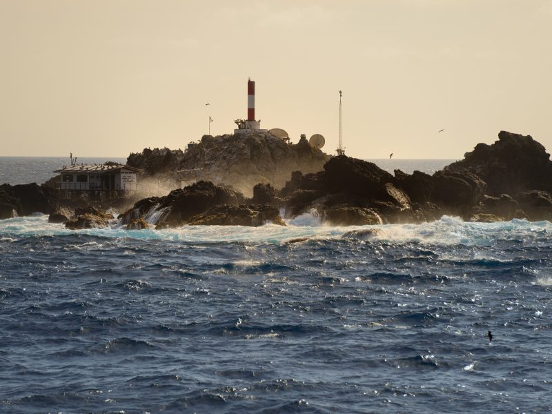 Hundreds of resident brown boobies (Sula leucogaster) circle above Saint Peter and Saint Paul Archipelago, a tiny set of islets in the middle of the Atlantic Ocean. Photograph by Novus Select