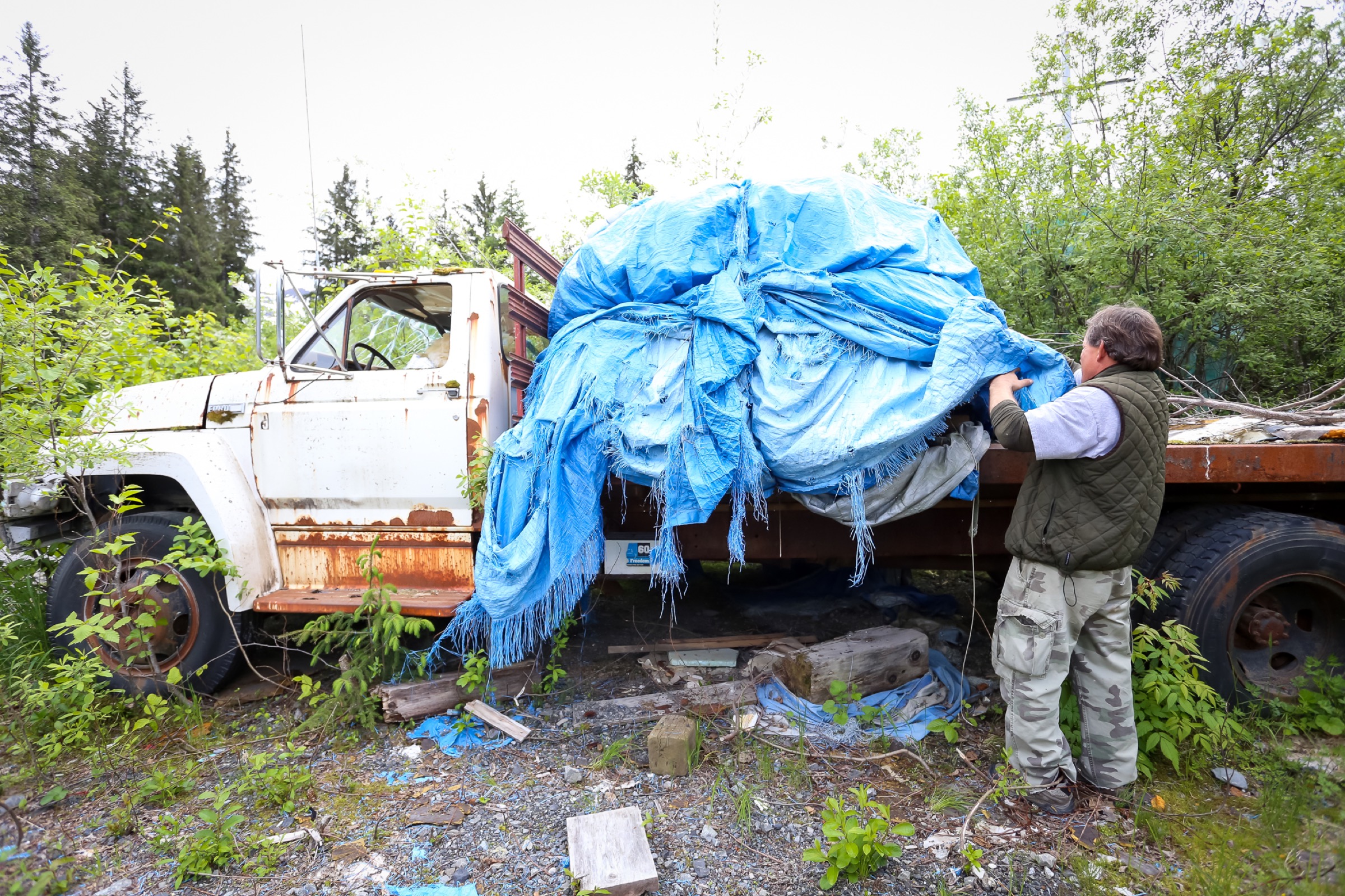 John Platt digs out his herring seine net from storage. Photograph by Julia Rosen