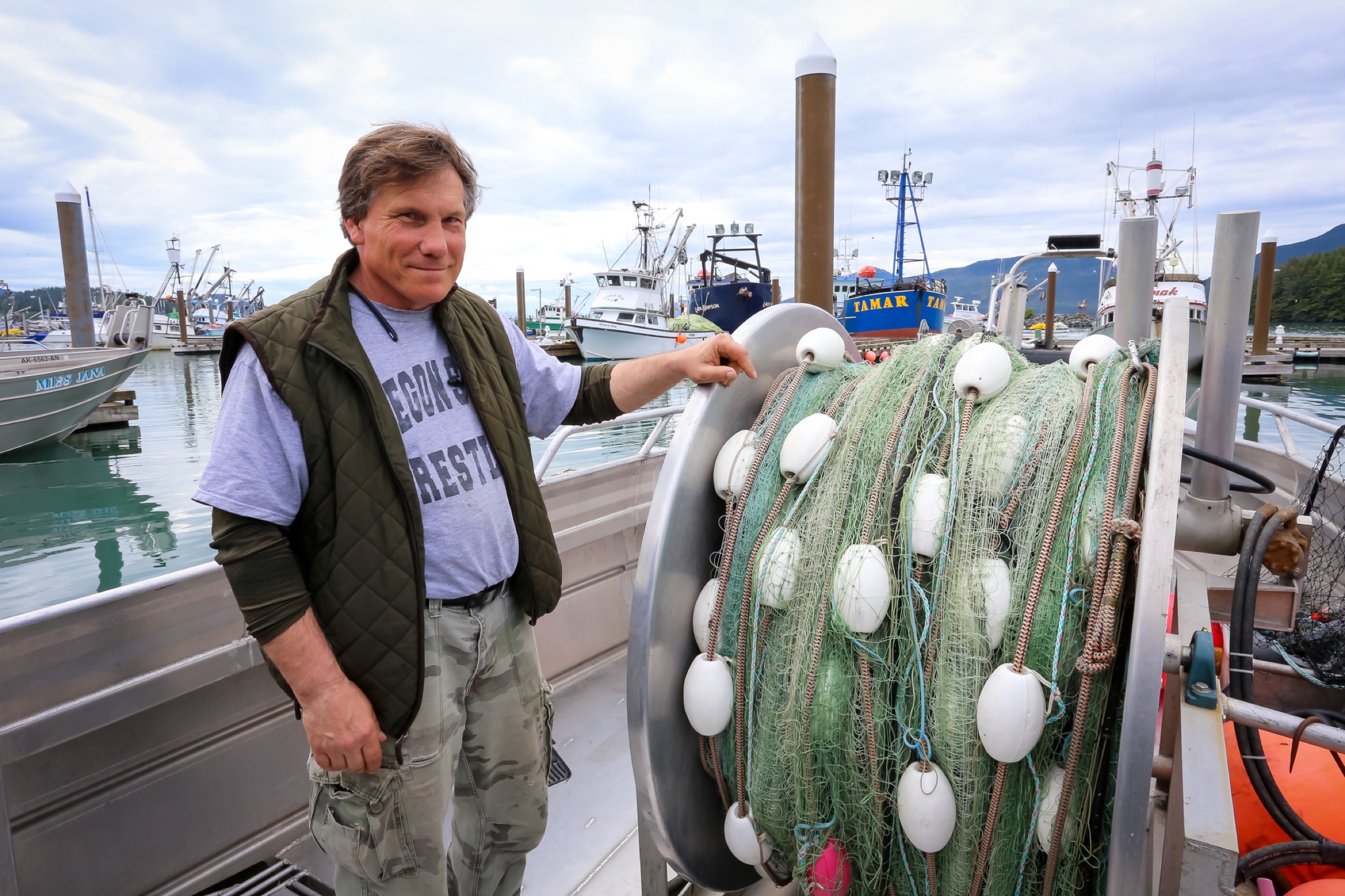 John Platt stands aboard his salmon gillnet boat, the Kokenhenic. Photograph by Julia Rosen