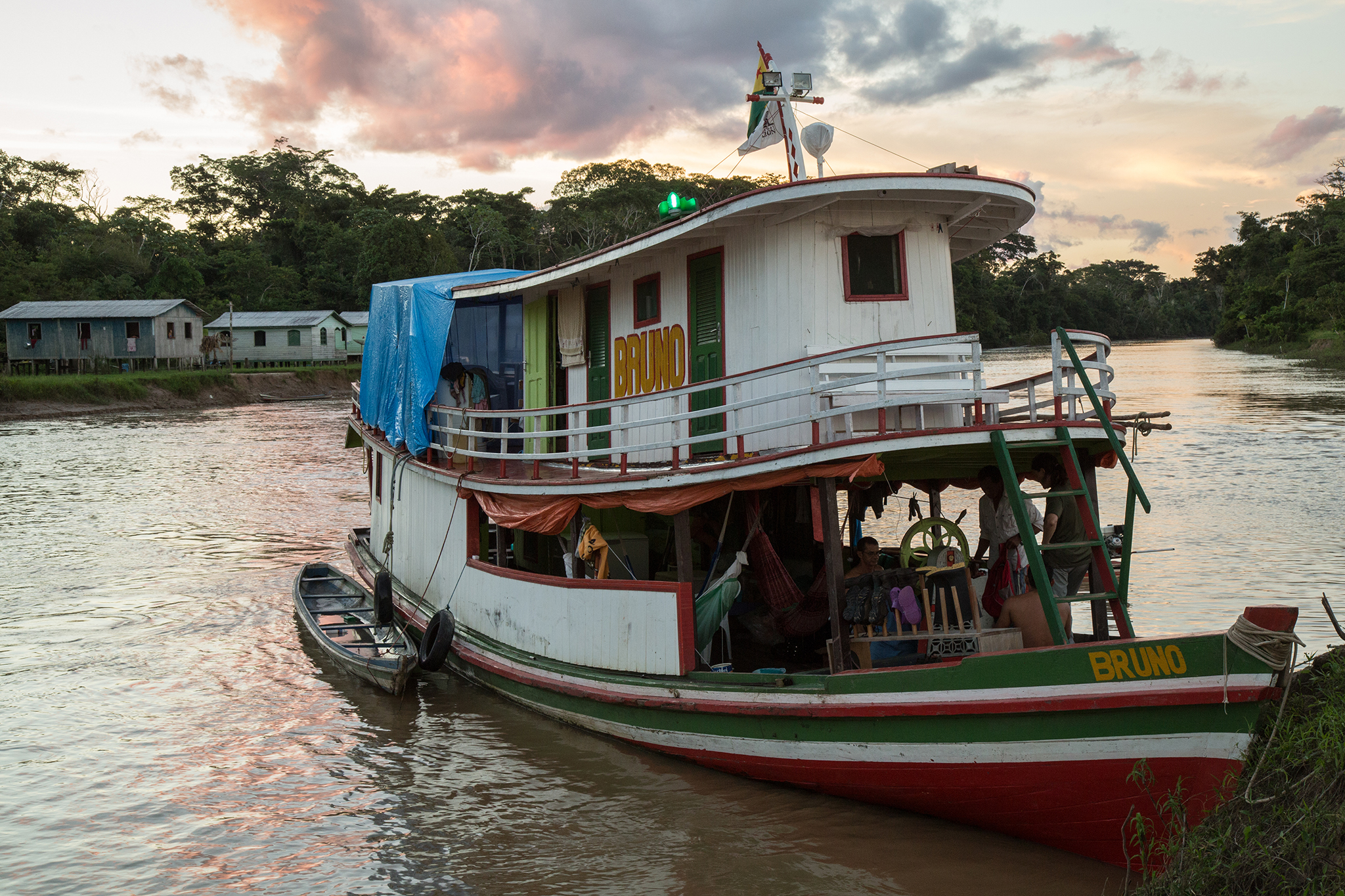 The houseboat which serves as a floating field station docks at Santa Catarina on the Rio Liberdade during the final weeks of the expedition. The expedition team spends two to five days in and around each community, surveying the surrounding forests and waterways for wildlife.