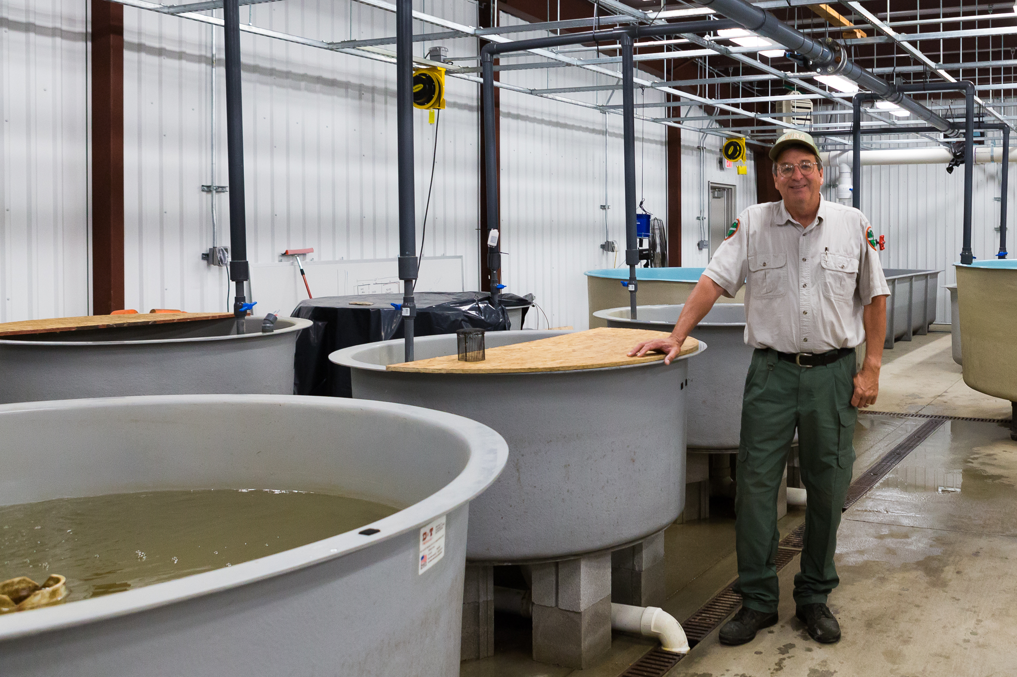 David Sims at the Cumberland Aquatic Center where he’s working to reestablish breeding populations of endangered freshwater mussels—photograph by Kathryn Whitney