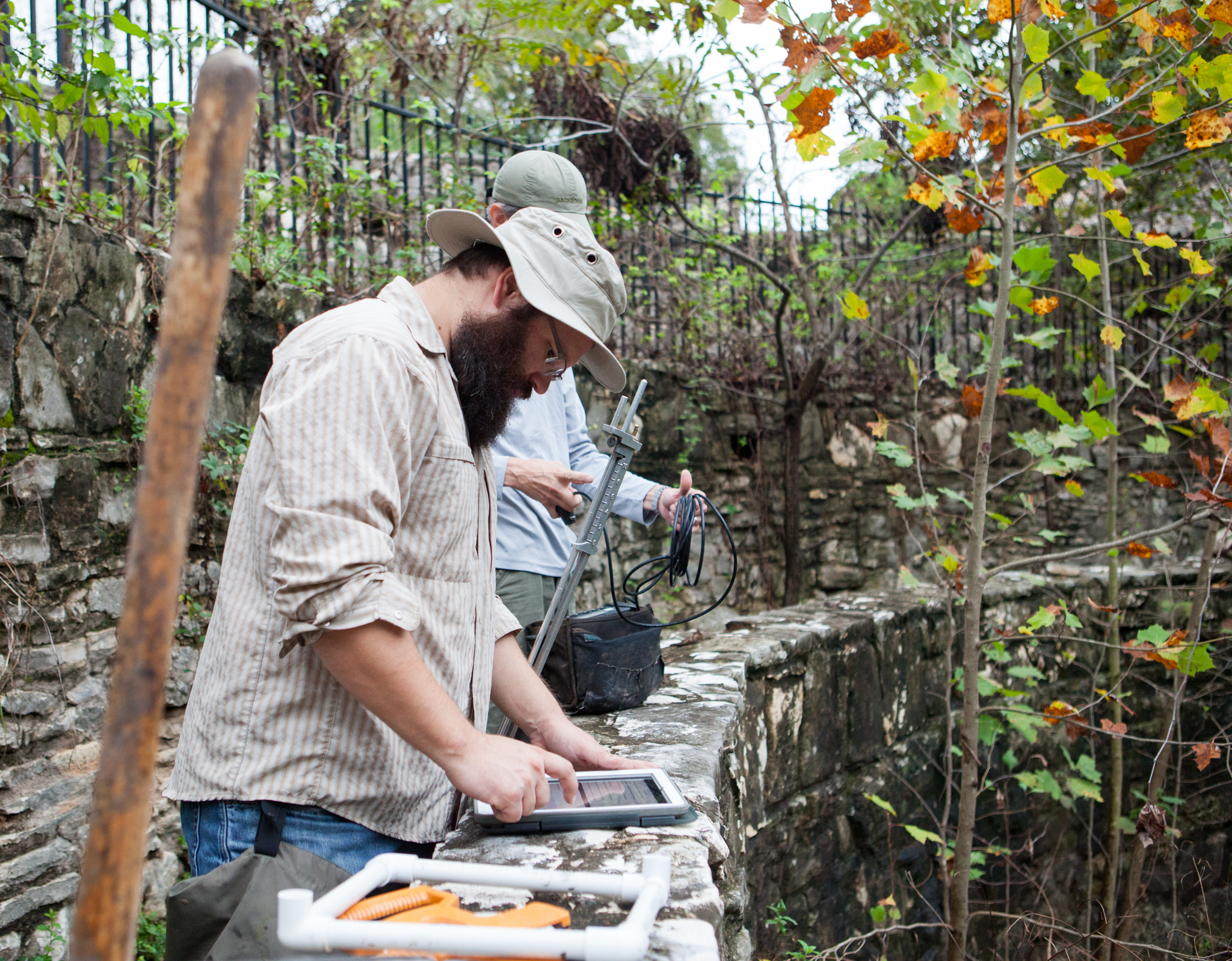 Nate Bendik, foreground, and Tom Devitt prepare their equipment before a survey for Barton Springs salamanders at Sunken Garden in Austin’s Zilker Park. Both are salamander biologists employed by the city.