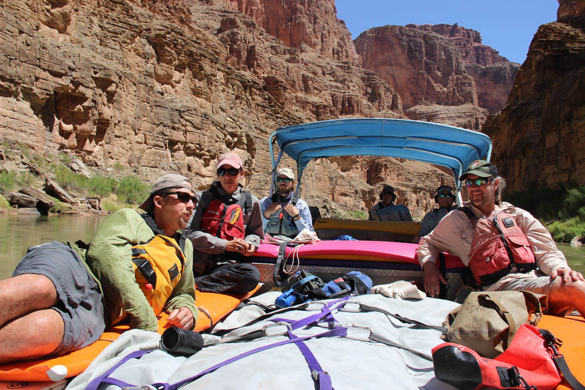The team lounges on the raft during a moment of downtime between seining sites—and between stretches of whitewater.