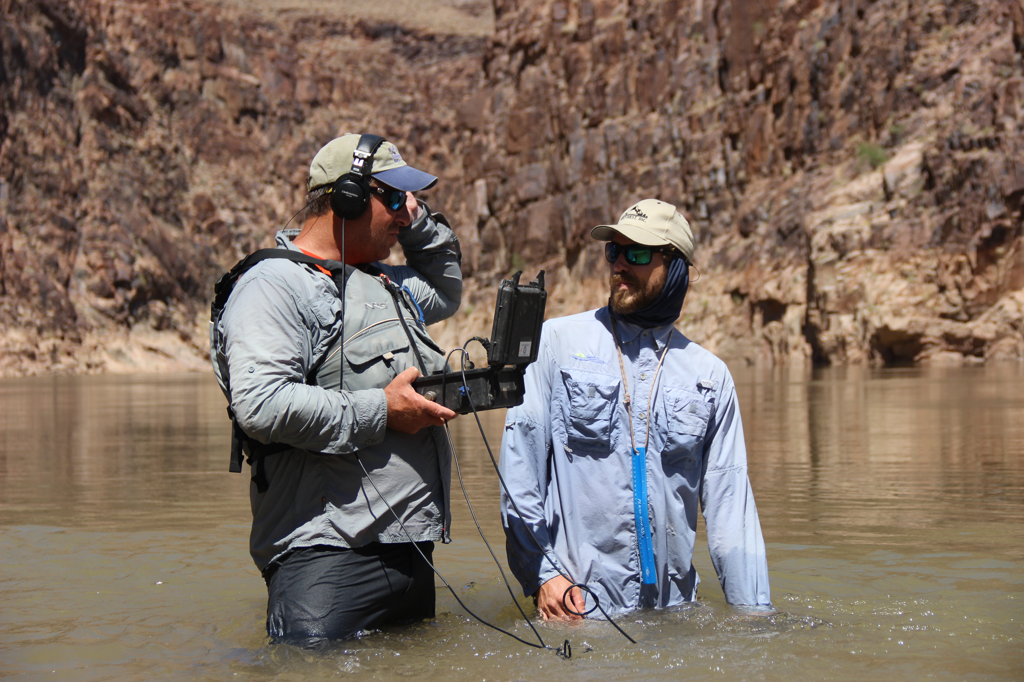 Brandon Albrecht and Mike Edwards use a hydrophone to listen for the pings of radio-tagged razorback suckers. In 2012, biologists captured an adult razorback in the Grand Canyon, fifty miles from Lake Mead, for the first time in decades.