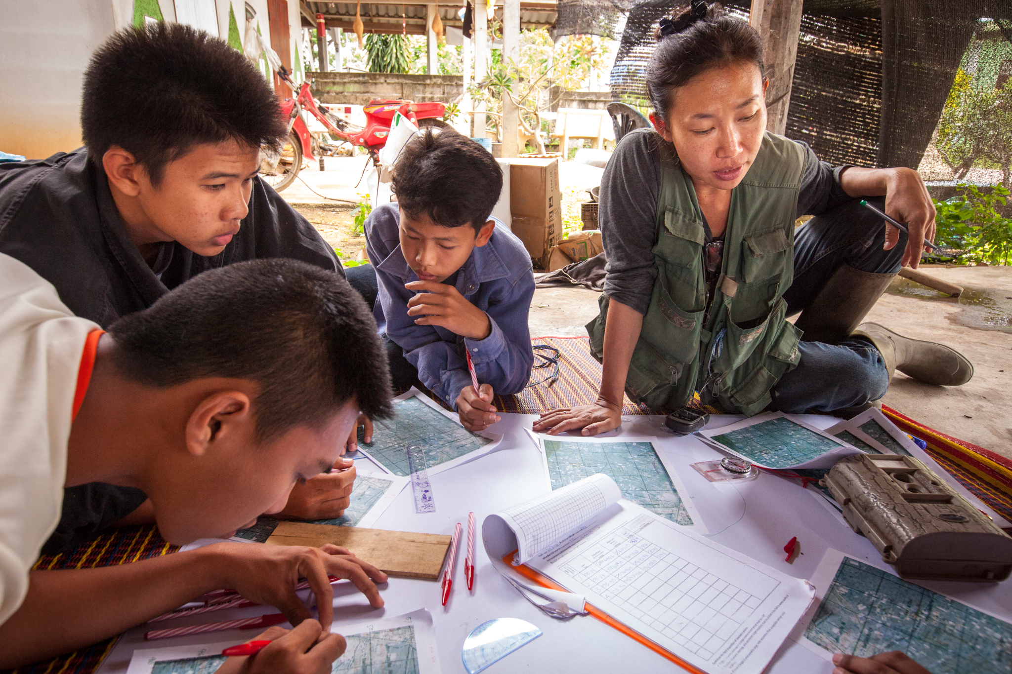 Several students, including Keeree (middle right) run through exercises in locating fishing cats using a series of GPS coordinates collected while radio-tracking fishing cats.
