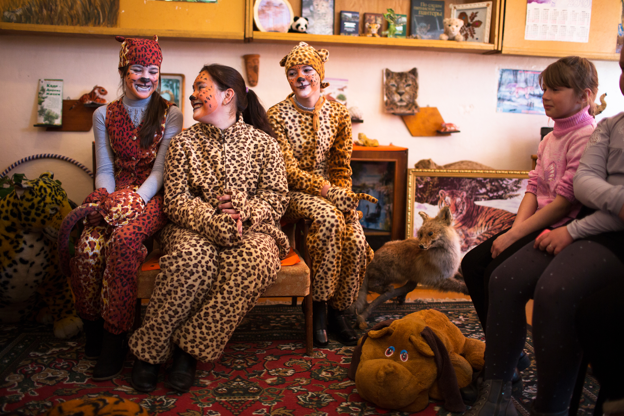 In Slavyanka, just outside the border of Land of the Leopard National Park, high school students Anya Blednova (front left) and two of her friends dress up as leopards once a month and visit grade schools to teach the younger children about the magnificent cats that live nearby.