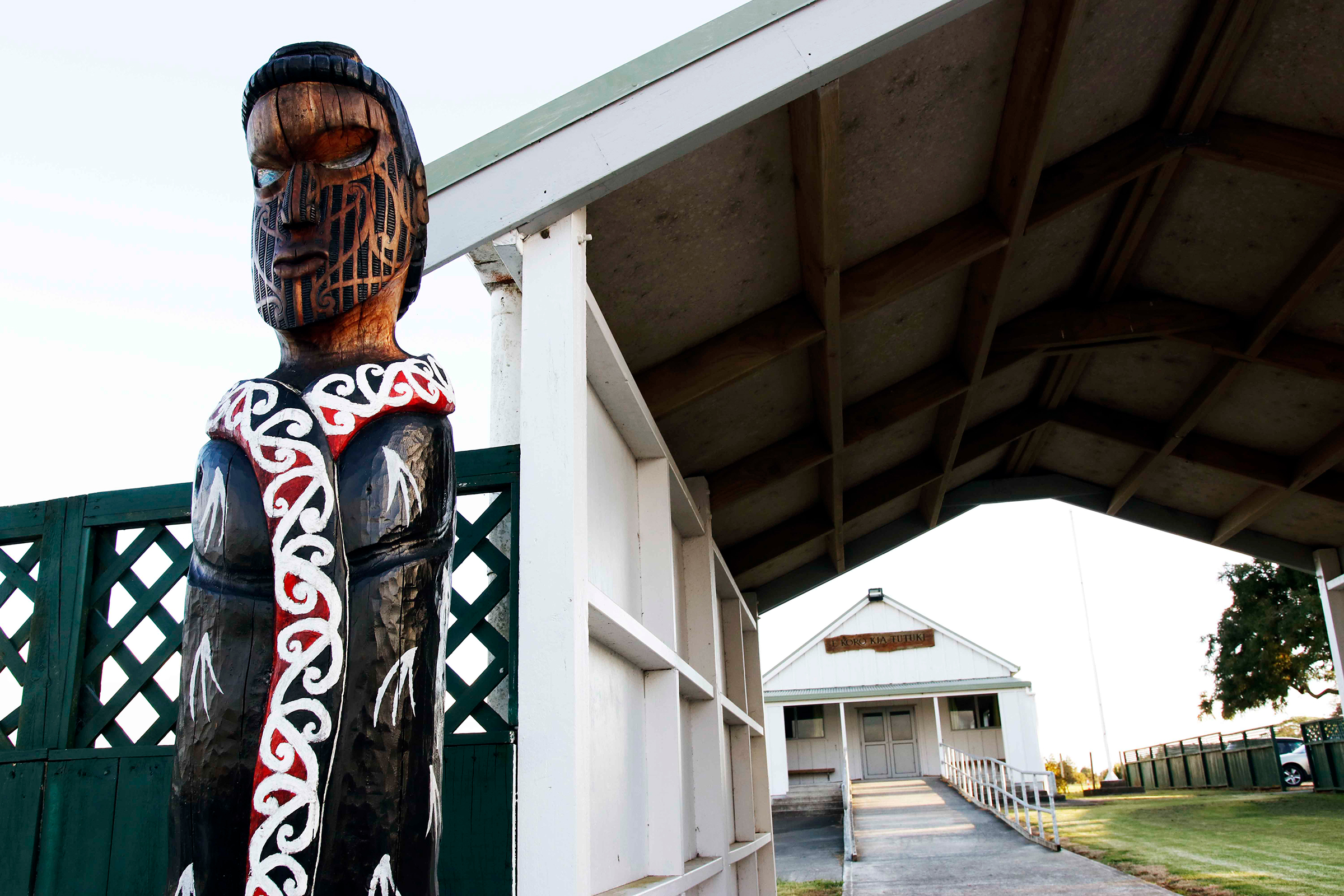A marae is a communal and sacred space that serves both religious and social purposes in Māori culture. The ancient kauri log was unearthed a few miles away from the Ngāwhā marae, and was gifted to the community by the company that found it. Photograph by Kate Evans.