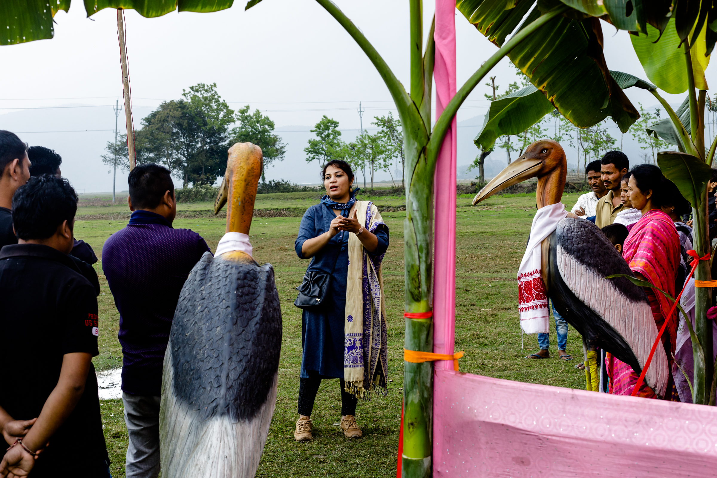 Biologist Purnima Devi Barman is pictured speaking to villagers and members of the "Hargila Army" at a cricket match organized to raise awareness and educate locals about greater adjutant conservation efforts.