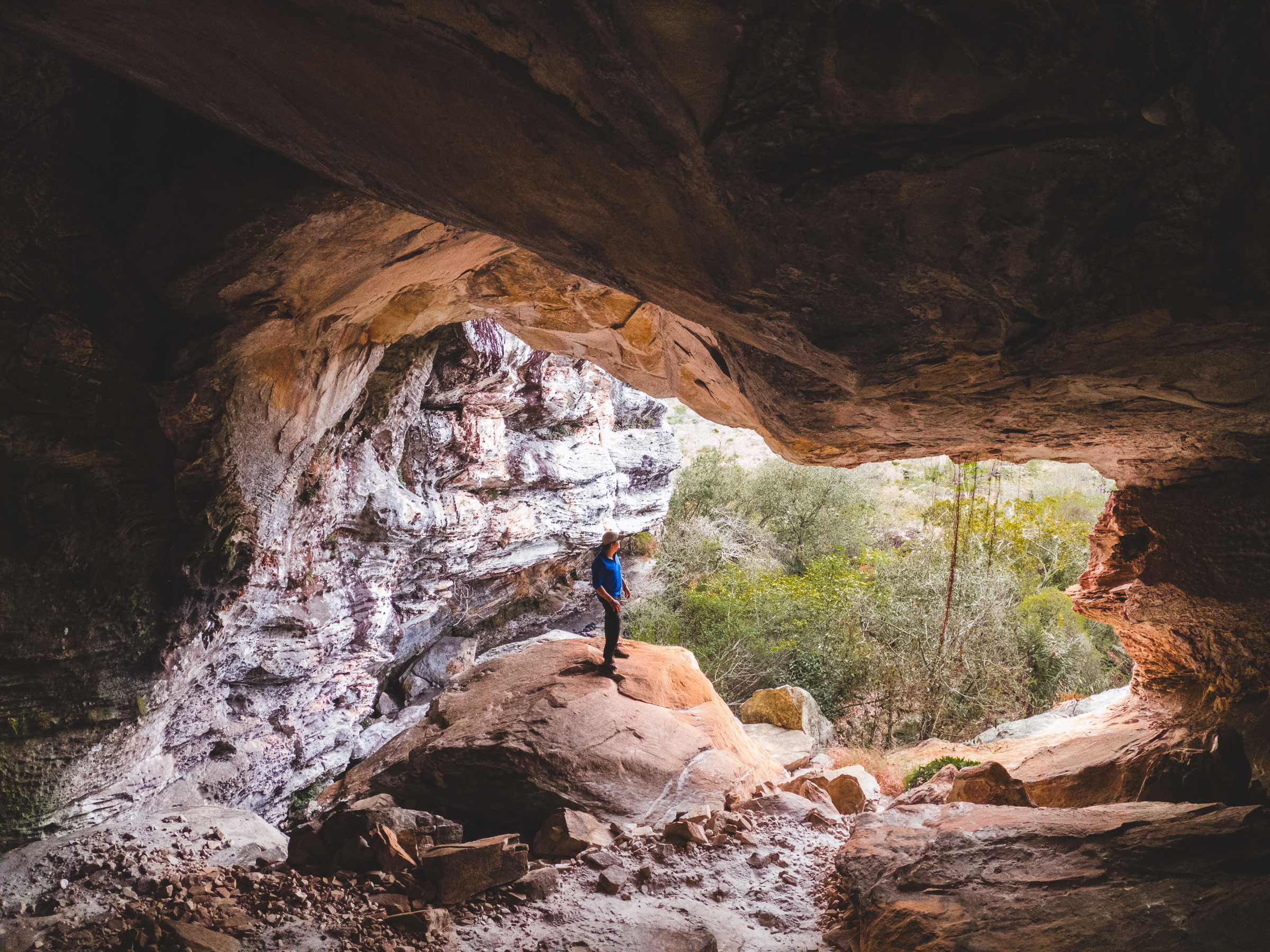 Alexsander Azevedo, coordinator of Instituto Biotrópicos, one of the most active NGOs in the Espinhaço, stands at the entrance of an unexplored cave near Diamantina, Minas Gerais. Experts estimate that thousands of new caves are yet to be discovered in this region, which opens up exciting possibilities for the discovery of new cave species.