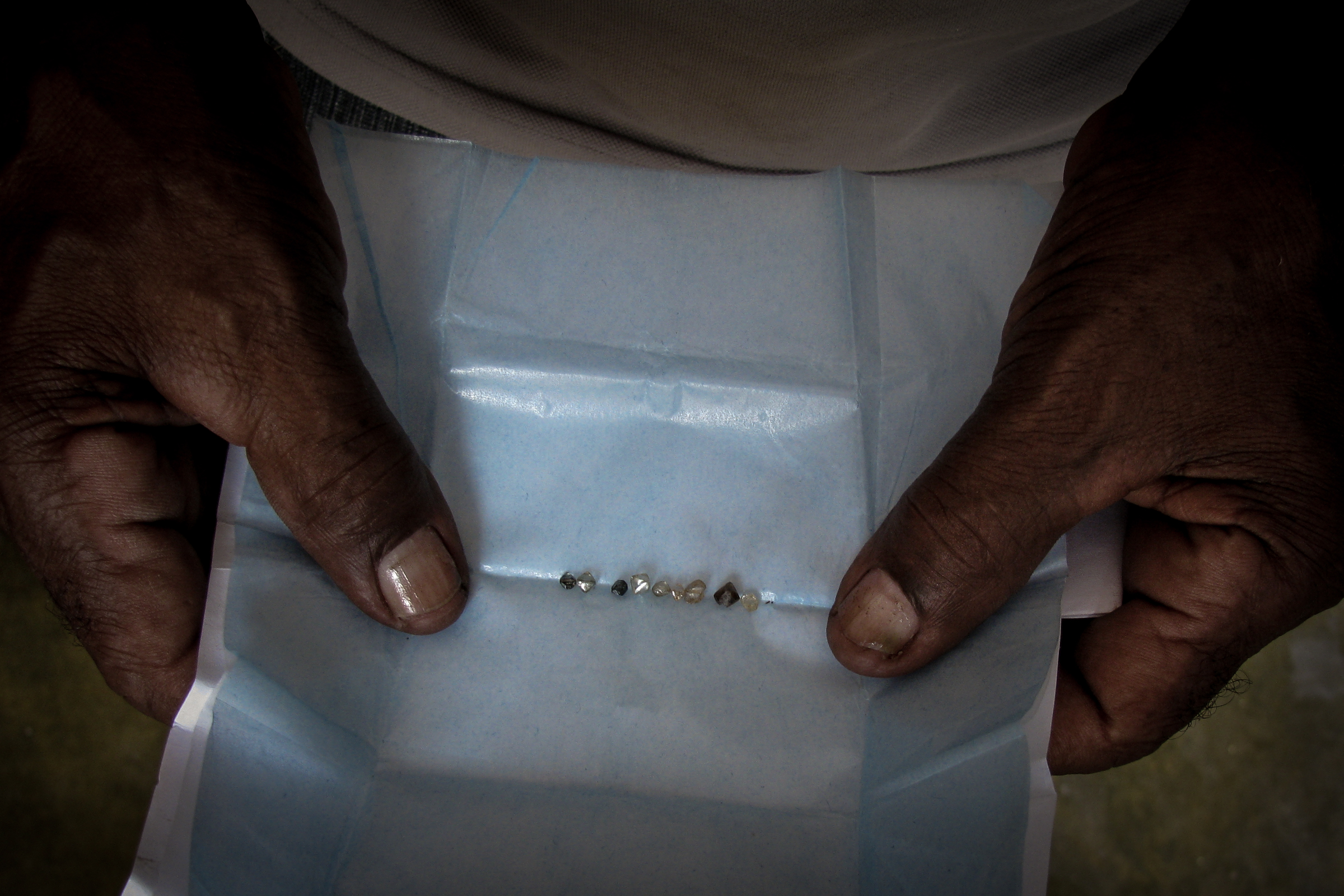 A miner displays a haul of diamonds extracted from streams in Chapada Diamantina, Bahia State using the same methods his ancestors used more than two centuries ago. These mining traditions have had an impact on the Campo Rupestre but may themselves be affected by large-scale development.
