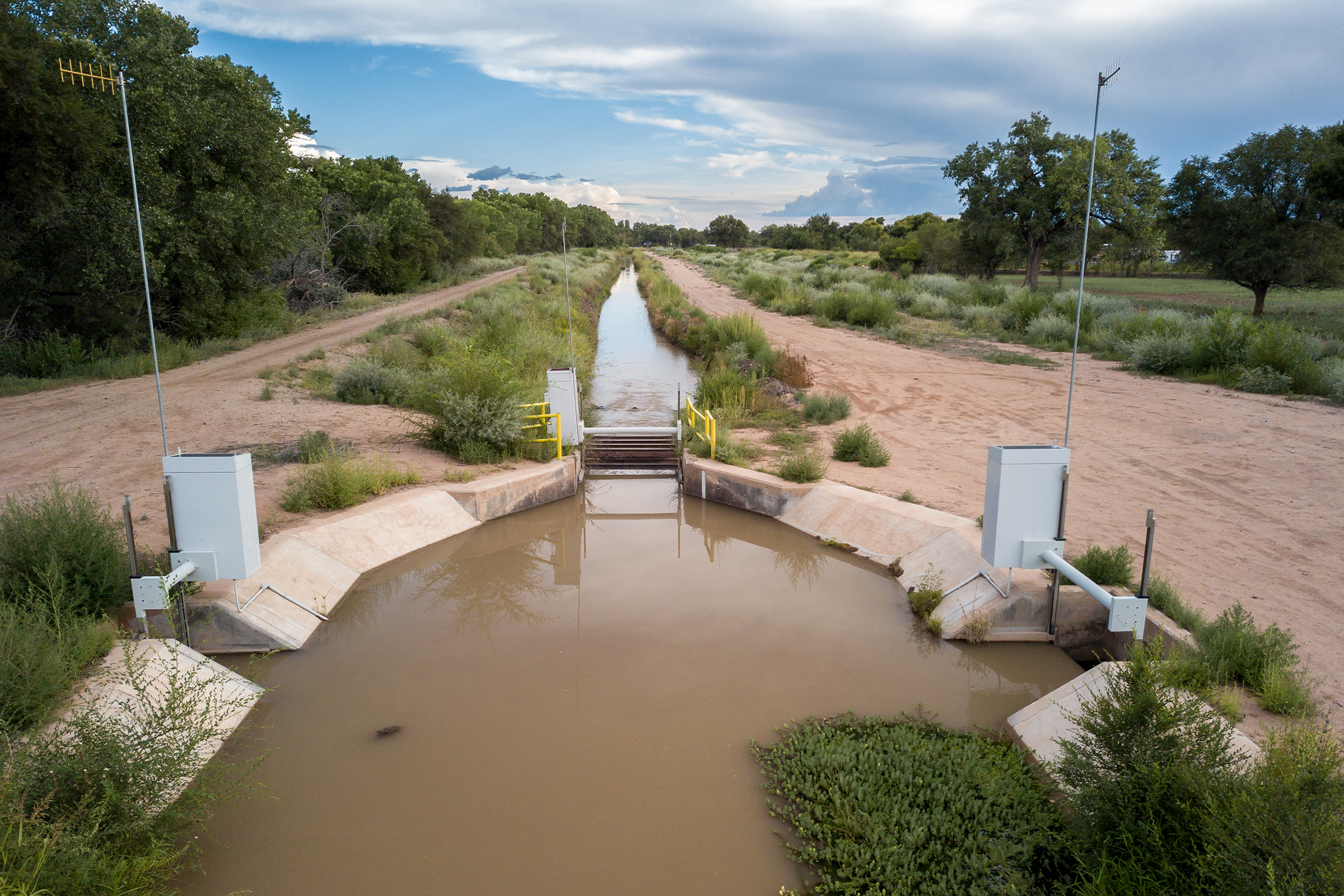 Outfalls, like this one near Belen, New Mexico, are part of the infrastructure used to return unused irrigation water from farms back to the Rio Grande. These return channels are an important source of water for the riparian ecosystem, especially during dry periods.