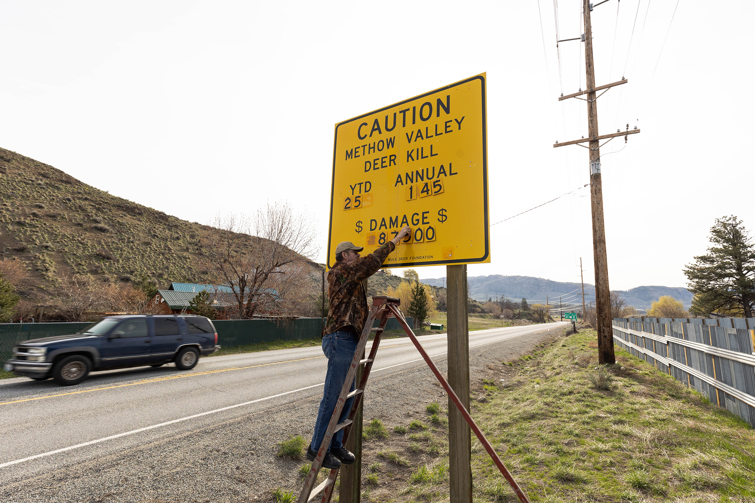 Jim Mountjoy updates this sign every month or so to indicate the number of deer killed so far that year, as well as the cost of damage done to the vehicles.