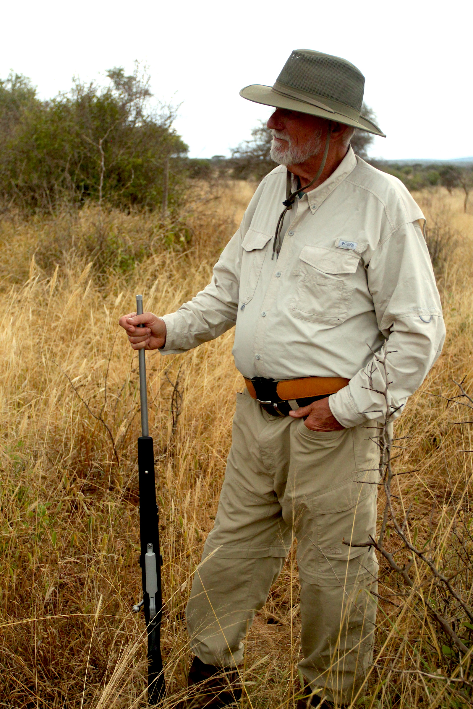 Scott’s father, Byron, takes a break from pursuing Cape buffalo and other game in the Ruvu-Masai hunting concession, Tanzania. Photography by Rachel Nuwer