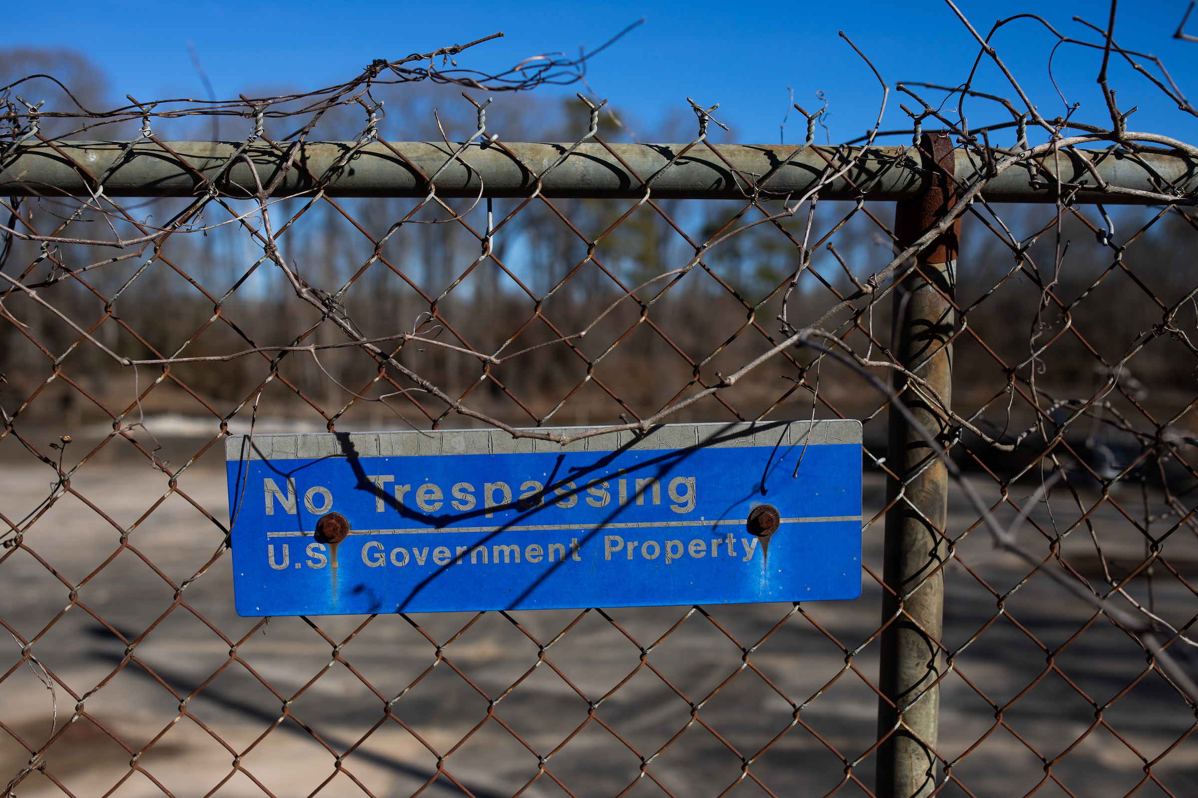 A sign hangs on the fence near an old lock and dam along the Cape Fear River just outside Elizabethtown, North Carolina. The lock and dam were built in the early 1900s when commercial boat traffic regularly used the Cape Fear River.