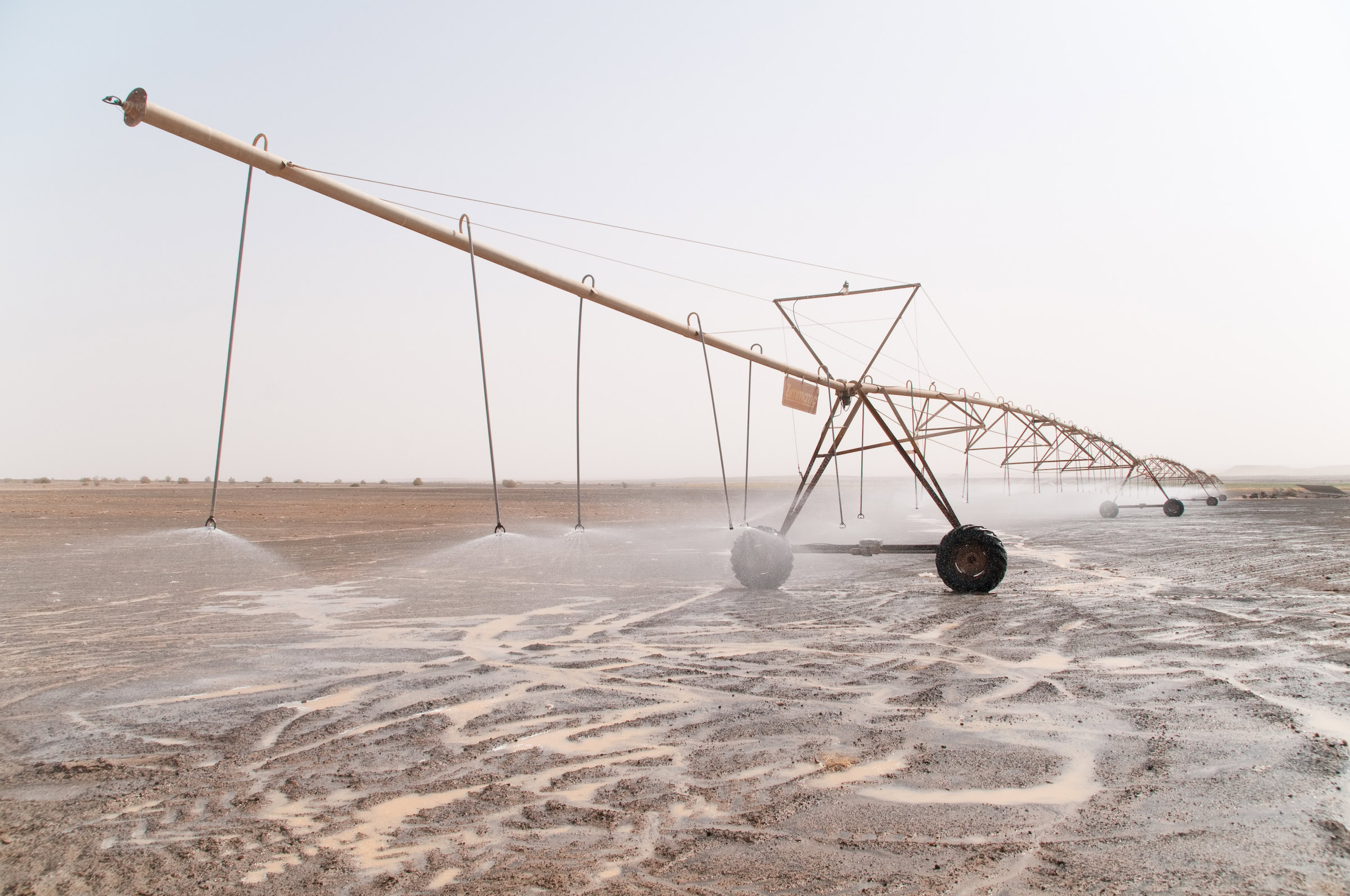 A solar-powered center pivot irrigation system waters the parched earth near the Syrian border in Jordan’s eastern desert, or Badia. Photograph by John Zada