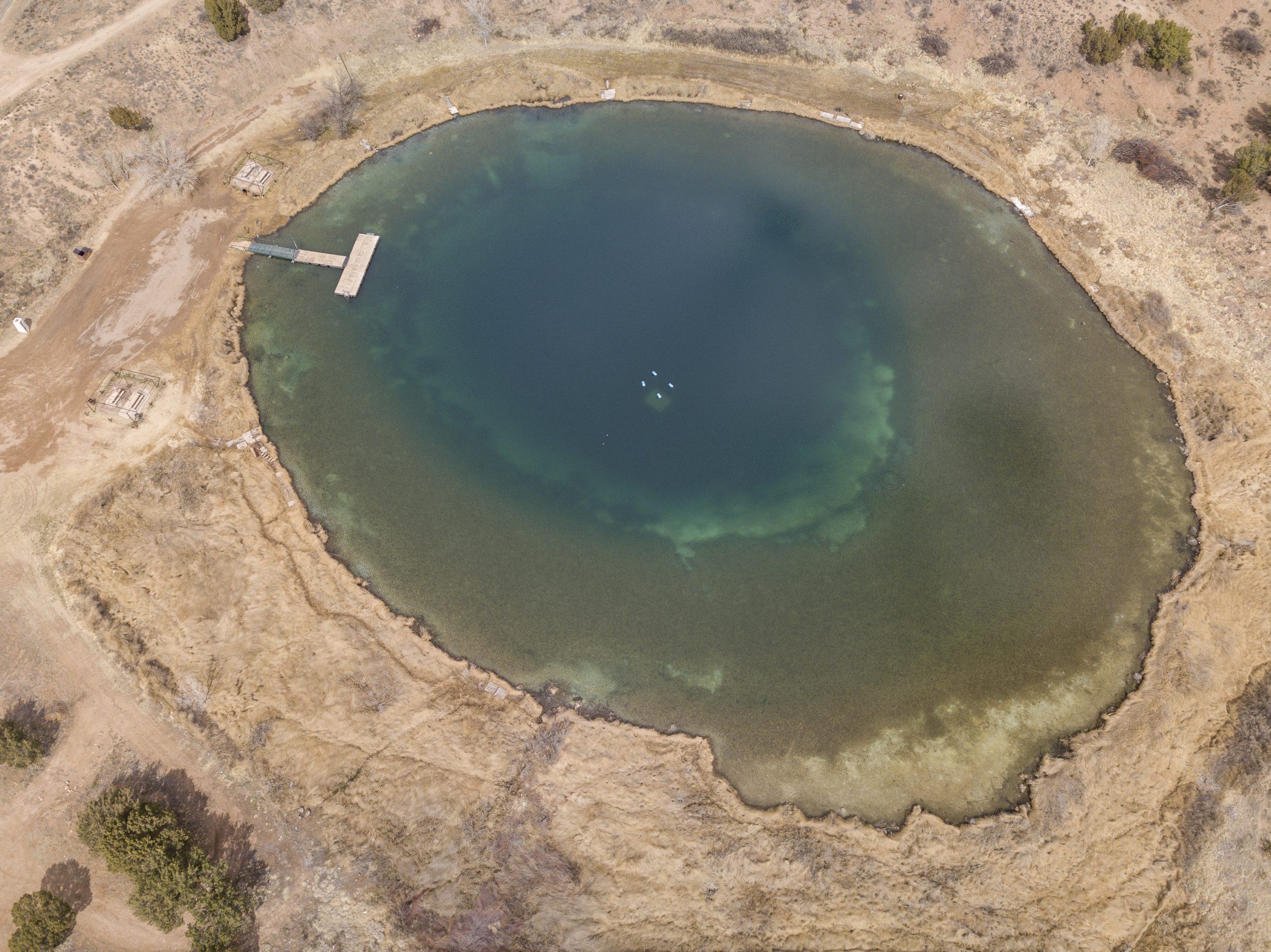 Percha Lake, a 55-foot-deep spring-fed sinkhole in the Santa Rosa Basin, was included in the bioblitz. It is used for swimming and scuba diving, with a sunken airplane at the bottom. The lake’s outflow creates a spring creek with rare desert fish, and a large ciénega.