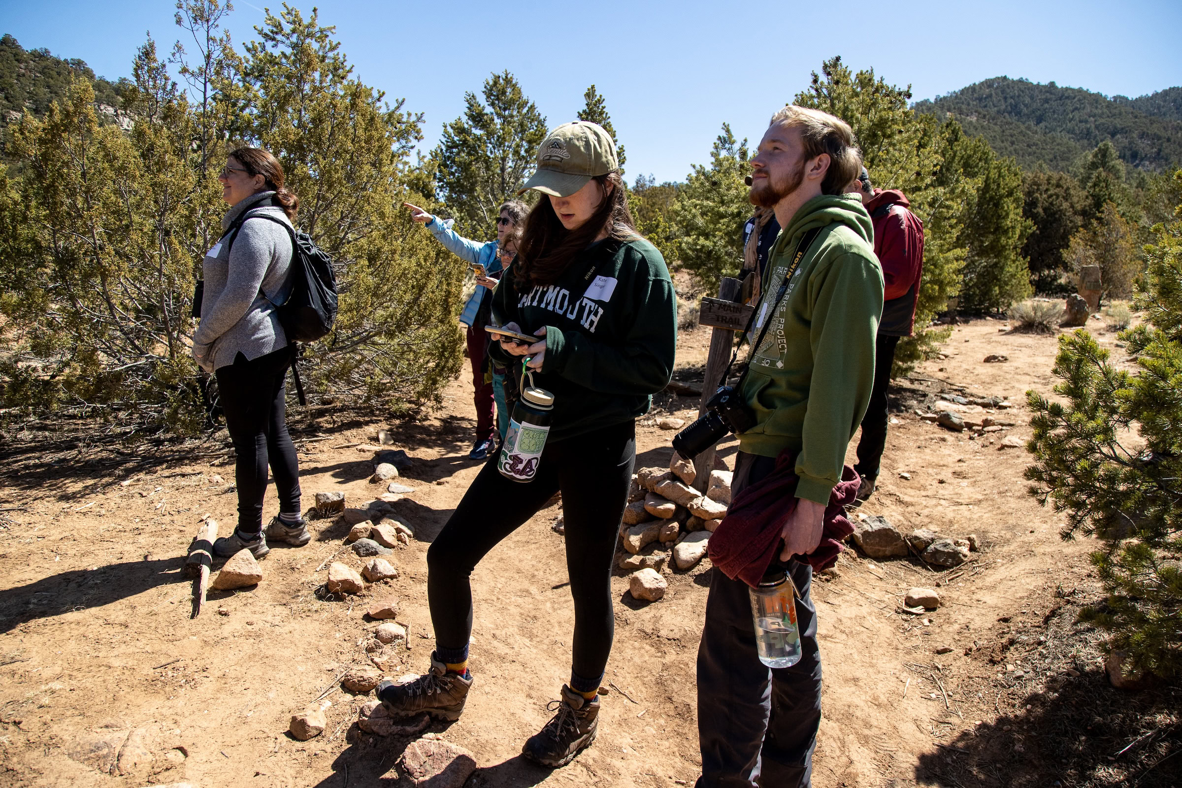 Members of the Sangre de Cristo chapter of the Audubon Society pause to listen for pinyon jays in a piñon-juniper woodland in Santa Fe, New Mexico.