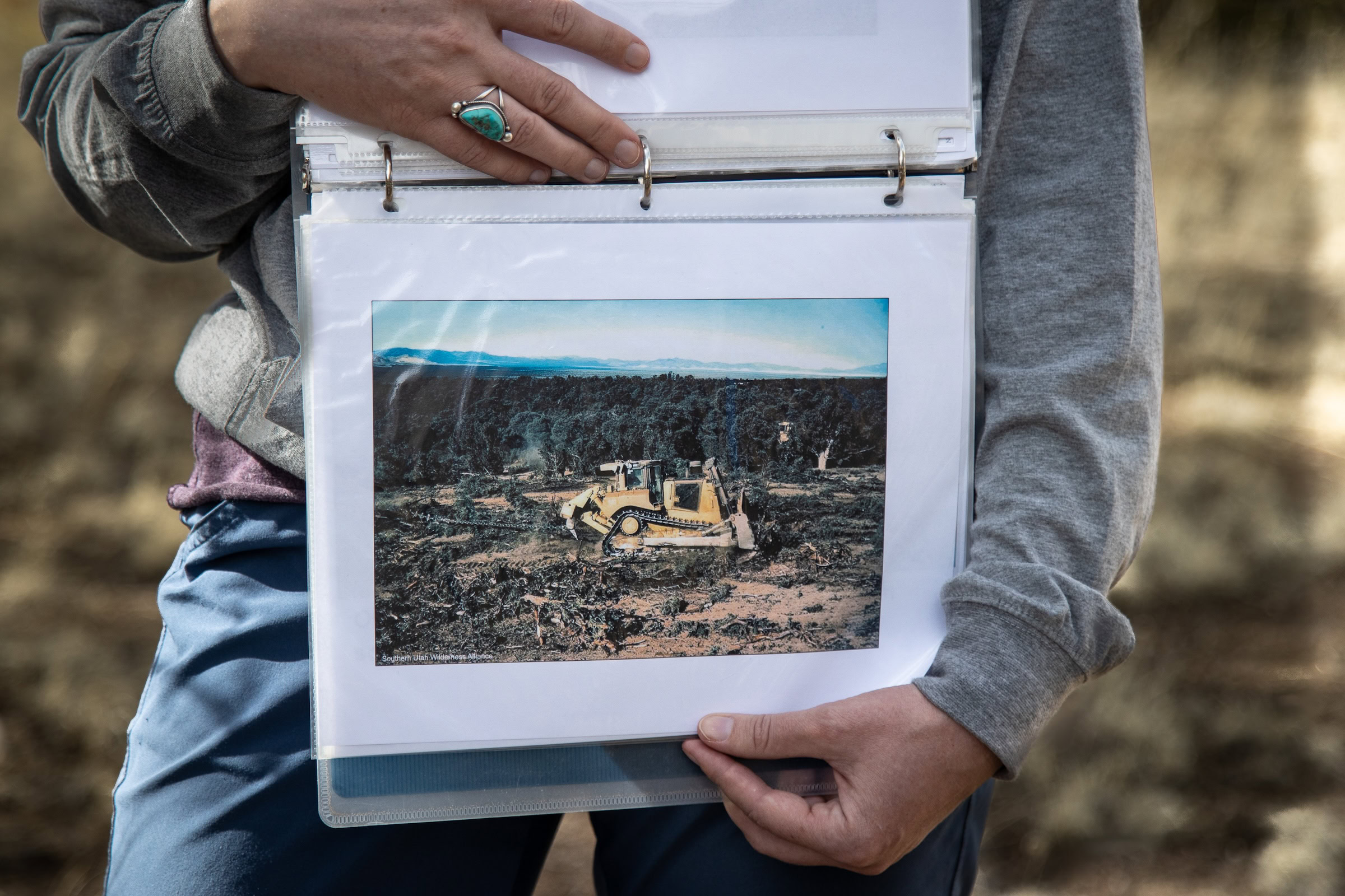 Lena Bain, citizen science workshop leader with the Grand Canyon Trust, explains the loss of piñon-juniper woodlands in the 1970s from "chaining,” a practice used by public lands managers to clear trees with an industrial-strength chain dragged between two bulldozers.