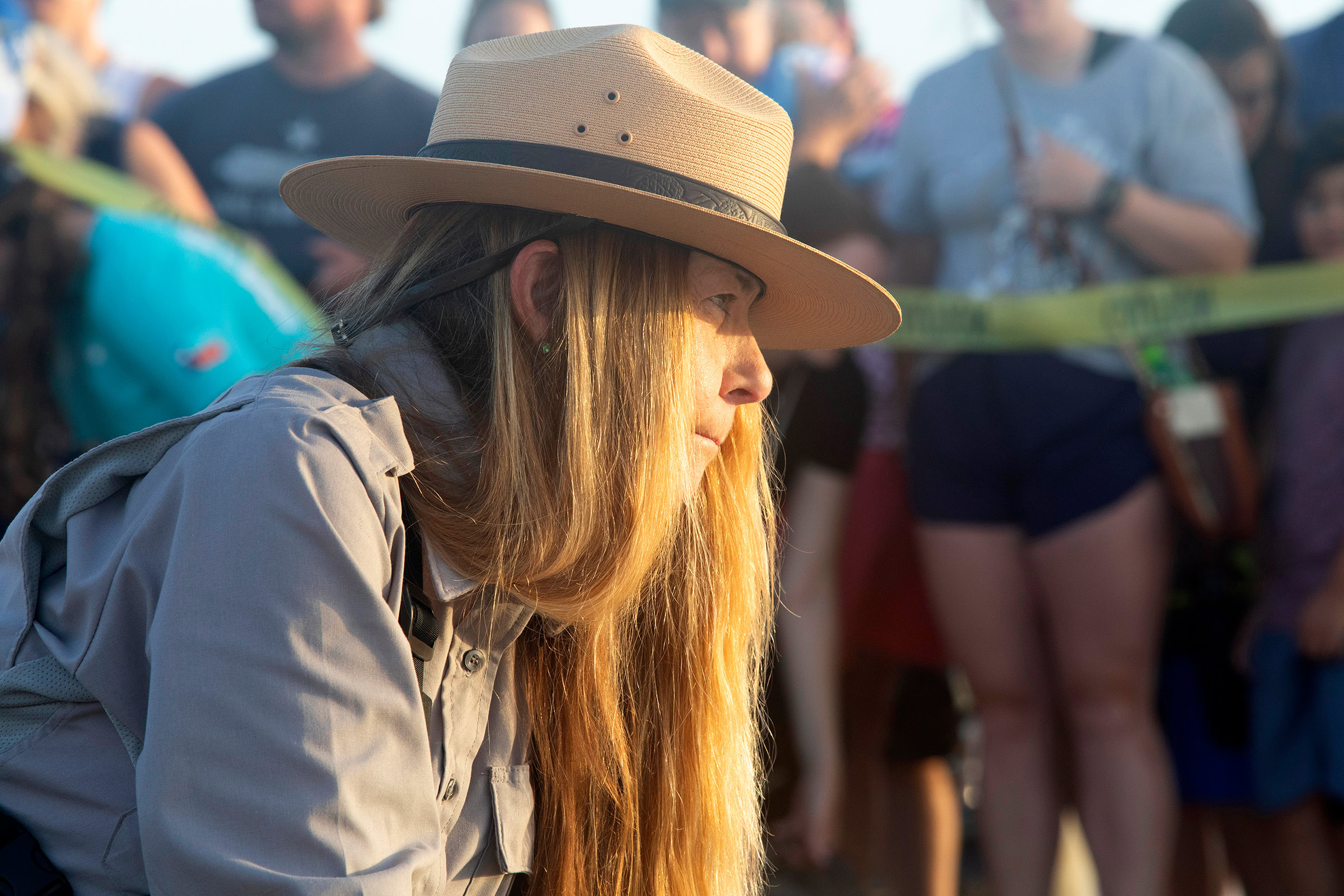 National Park Service biologist Donna Shaver watches as recently released Kemp’s ridleys make their way to the sea. Shaver has spent decades working to protect the endangered turtles.