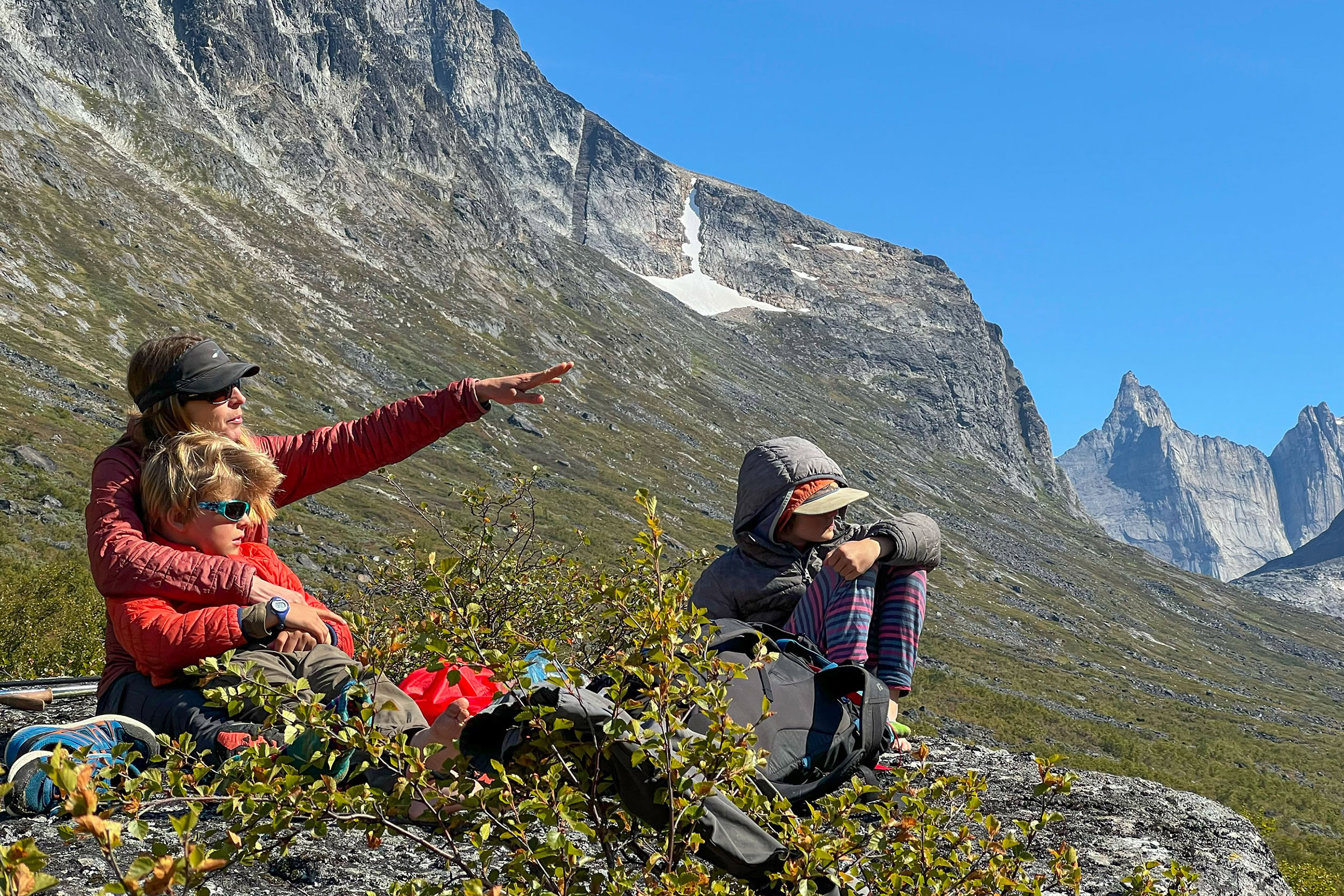 The author and her two sons scan for a peregrine falcon aerie in Monastery Valley, Greenland. Photo by Patrick Farrell