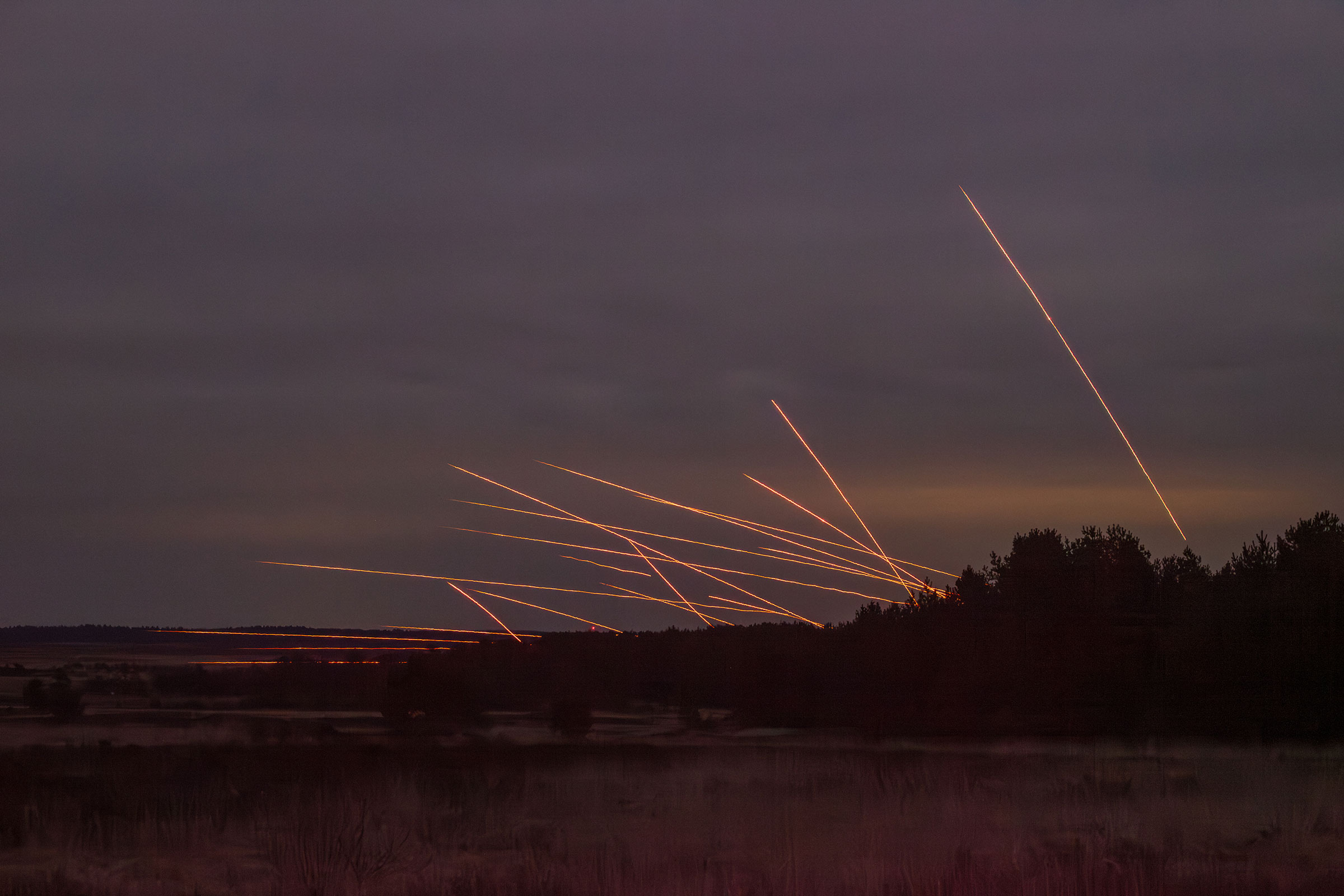 rockets firing above trees at a military base in Germany
