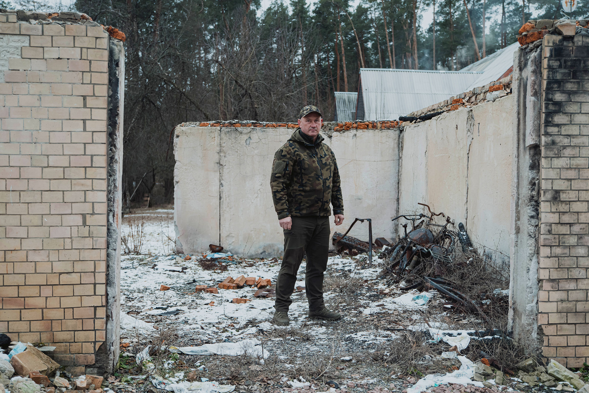 Park director Taras Kohut stands in what’s left of a garage that was destroyed in Zalissia park during conflict with Russian troops in March 2022.
