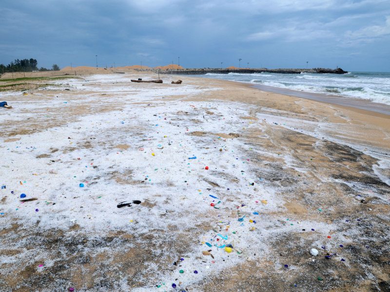 nurdles and plastics on beach in India after a shipwreck