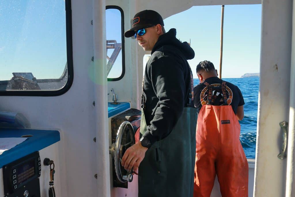 Michael “Mikey” Volaski pilots his commercial fishing vessel, the Coastal Reign, off the coast of one of California's Channel Islands as he and his crew search for brown box crabs