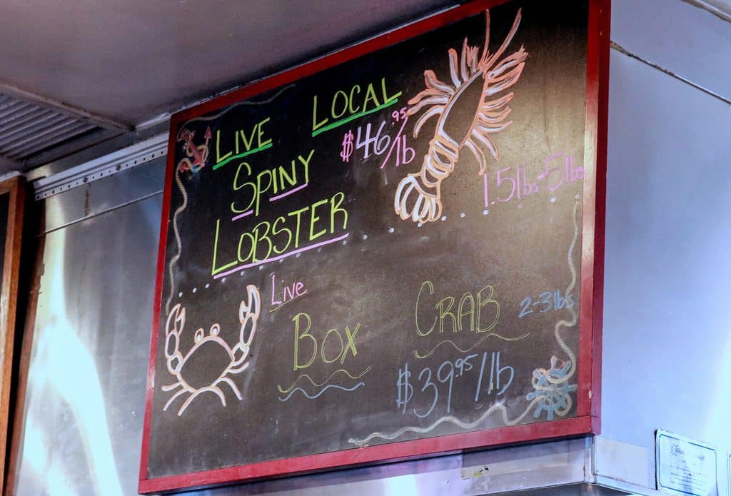 A chalkboard sign inside the Santa Barbara Shellfish Company restaurant advertises a special on live box crabs: $39.95/lb.